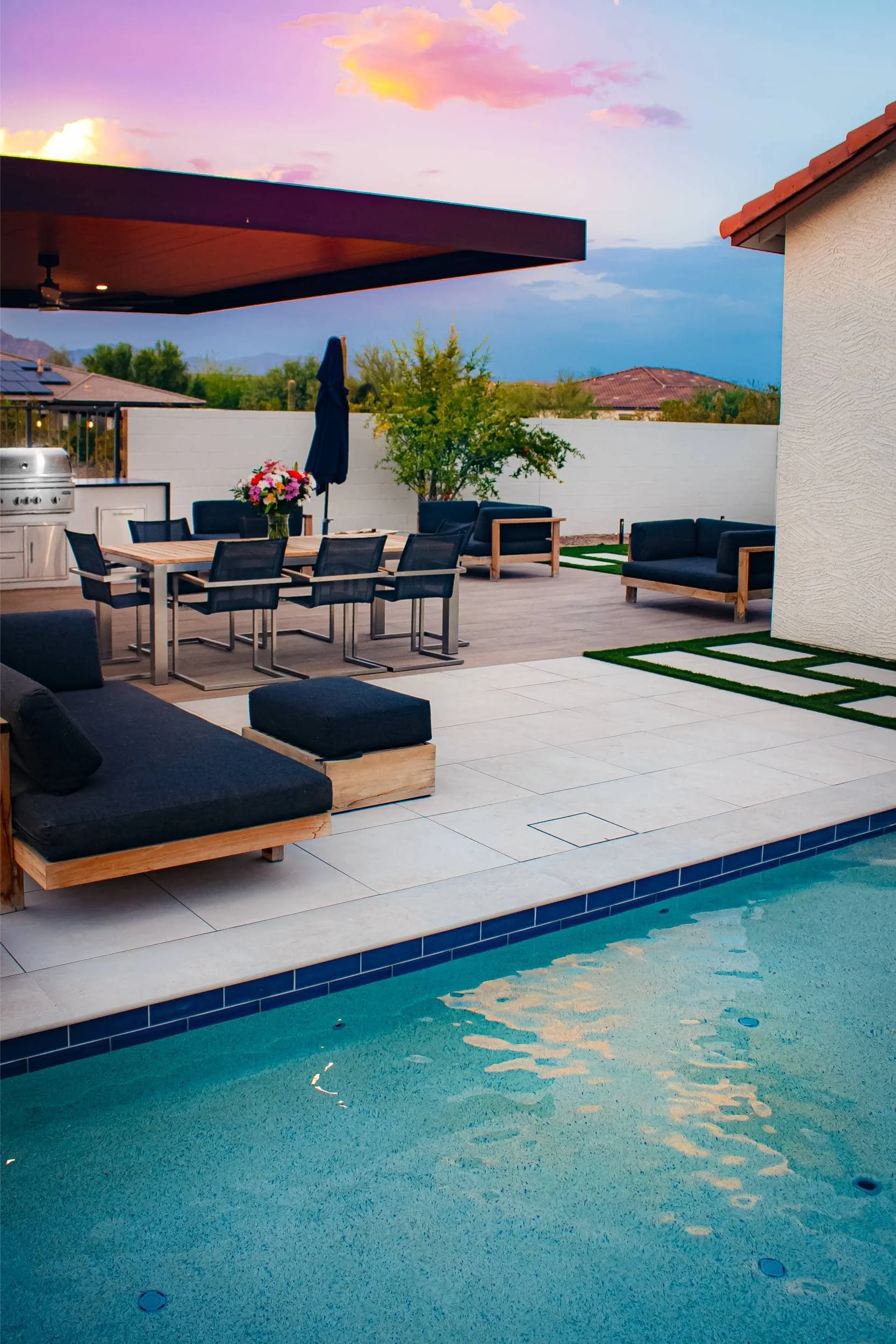 Backyard layout with artificial turf and clean landscape design lines in Queen Creek, AZ