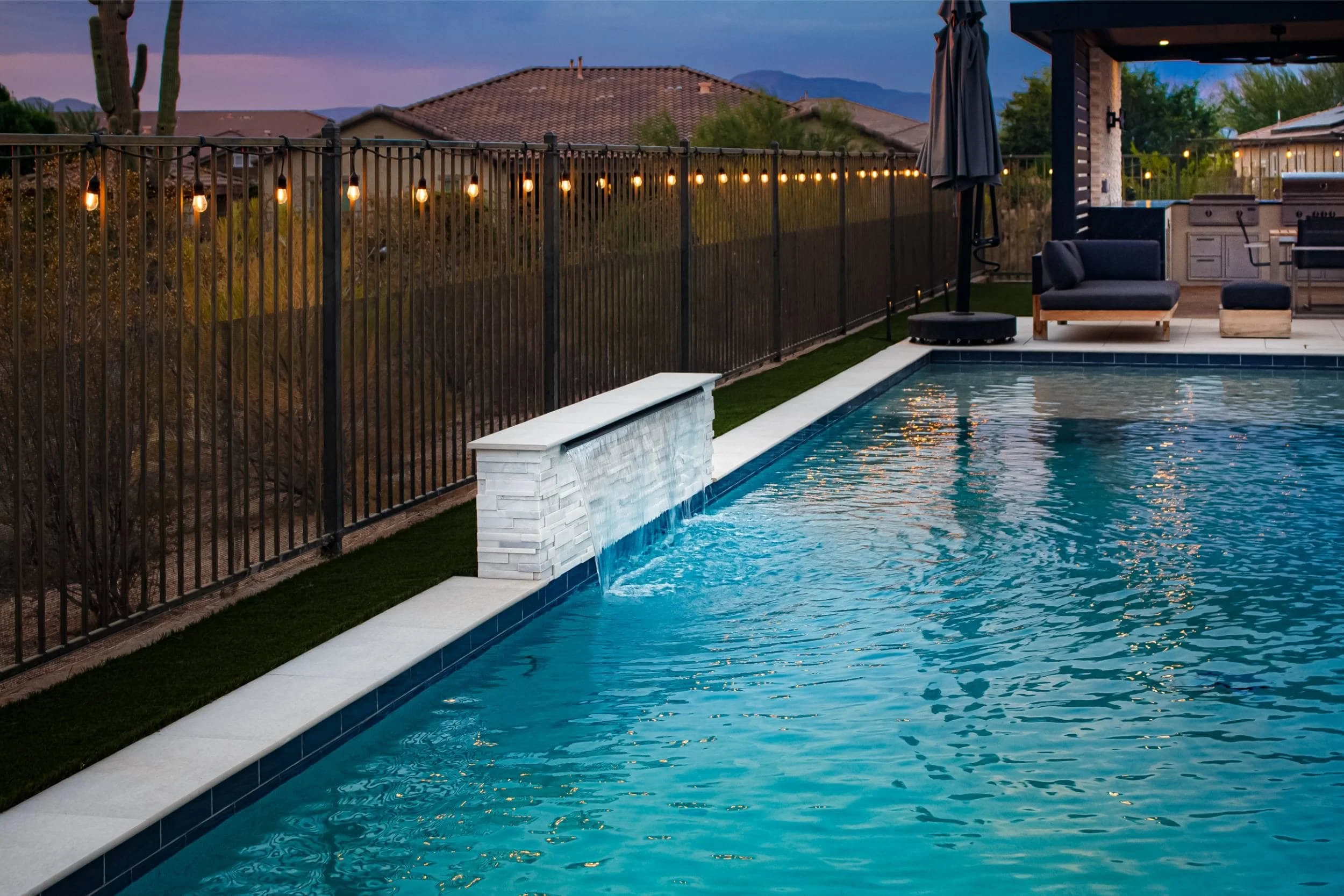 A modern water feature in Scottsdale, AZ incorporated into a clean landscape design
