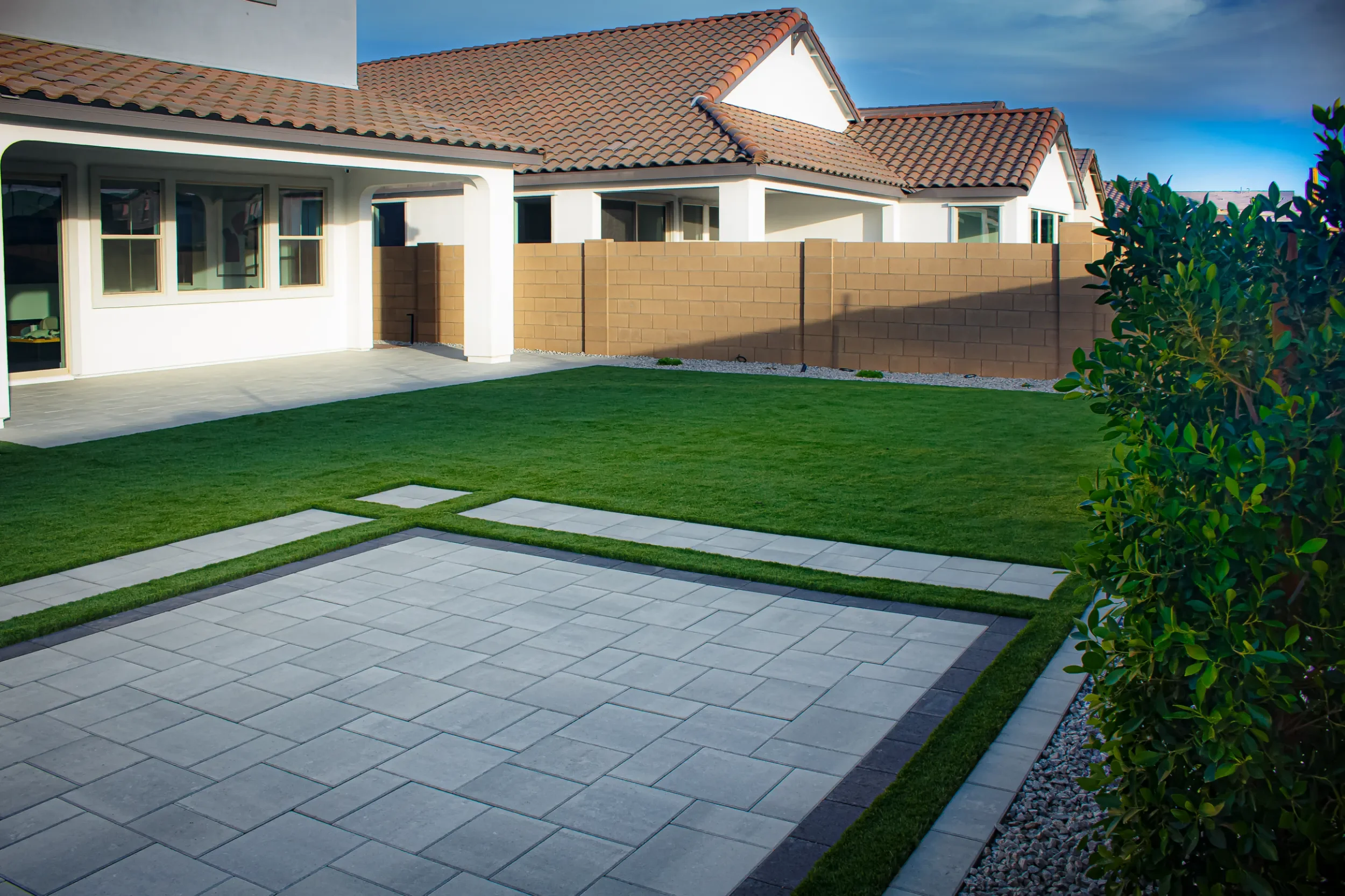 Backyard remodel with artificial turf and modern landscape design in Mesa, AZ