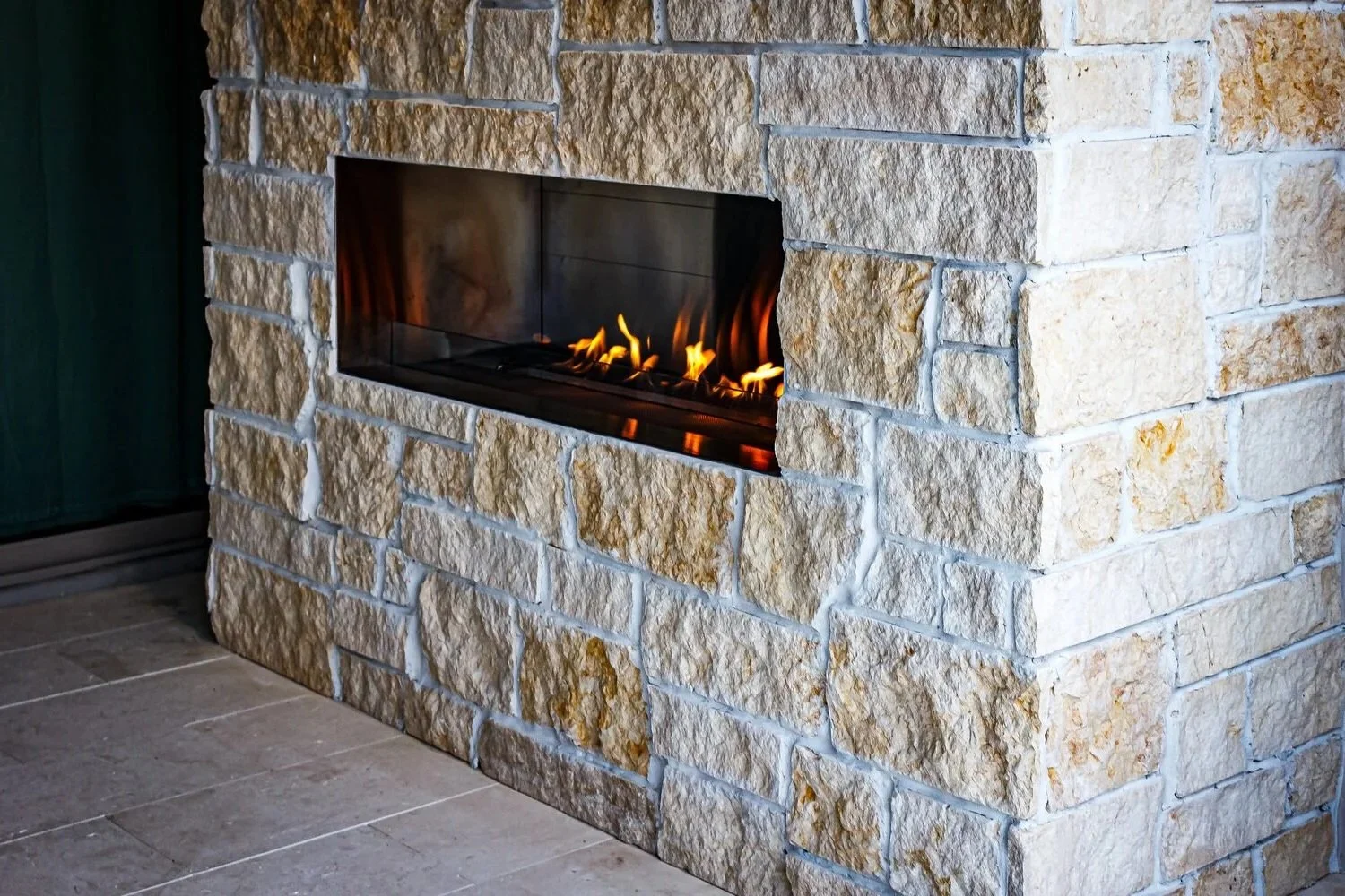 stone outdoor fireplace with surrounding seating in Glendale, AZ