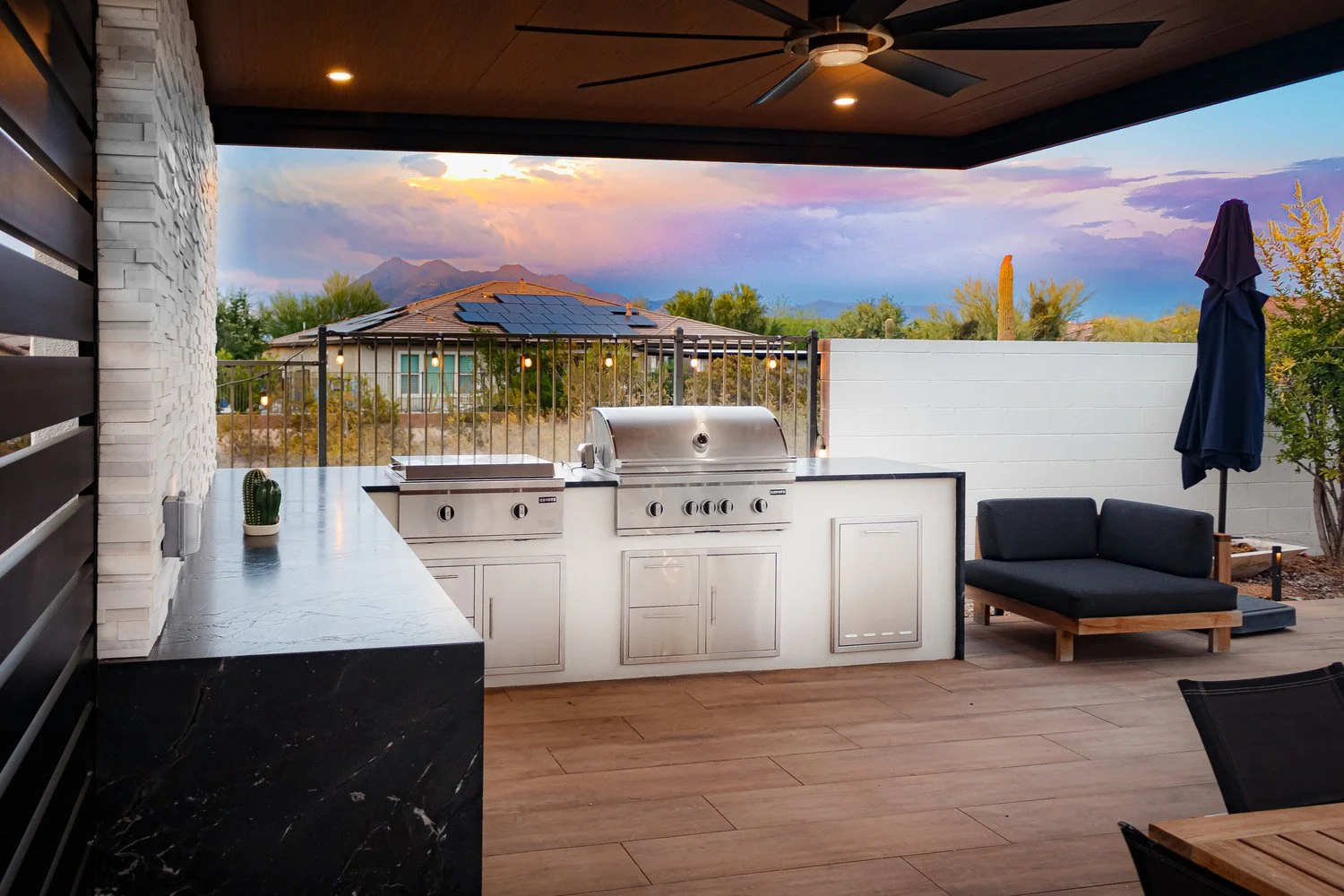 Seating area under the pergola arranged beside putting greens and turf in Phoenix, AZ