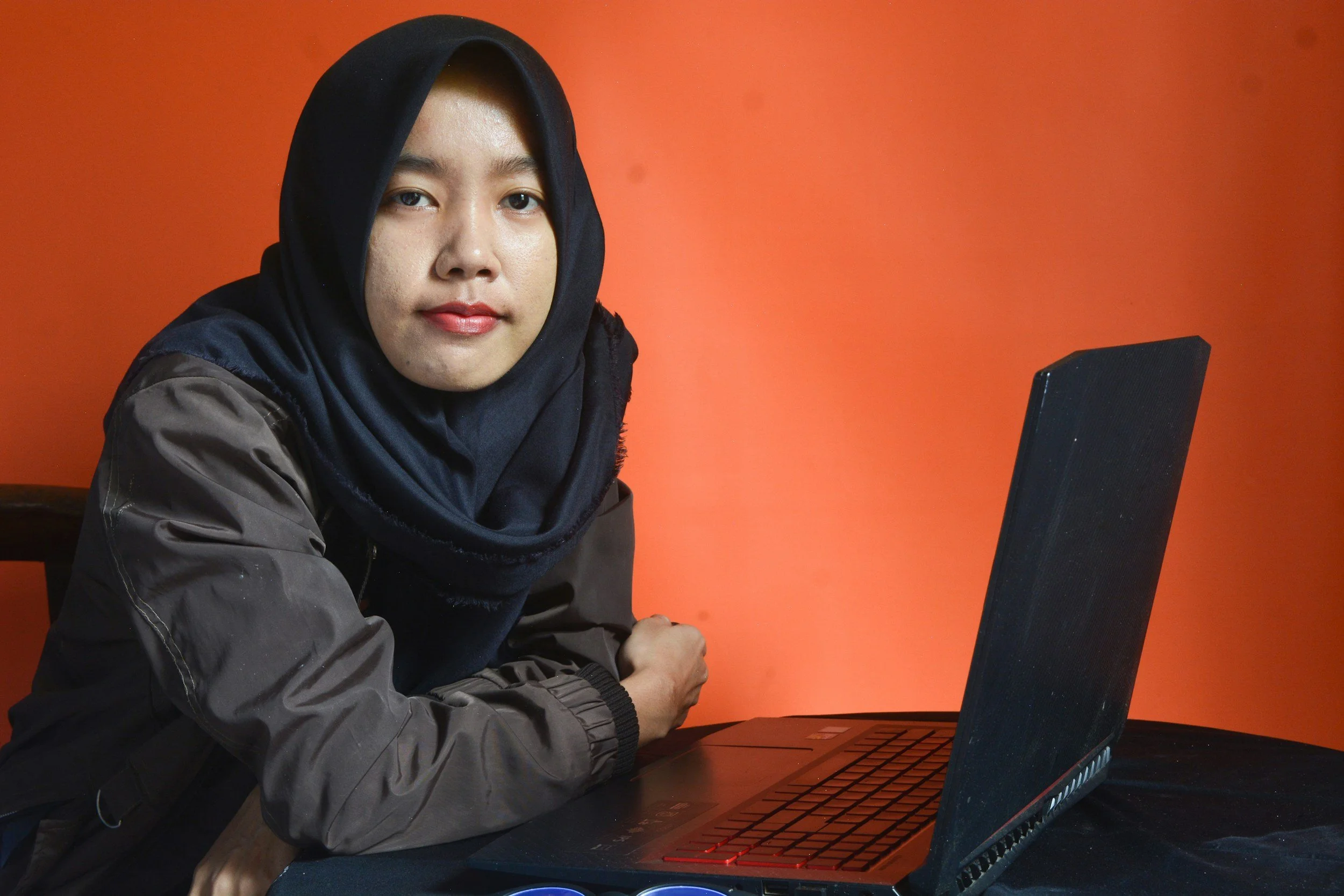 Client attending an online therapy session by computer