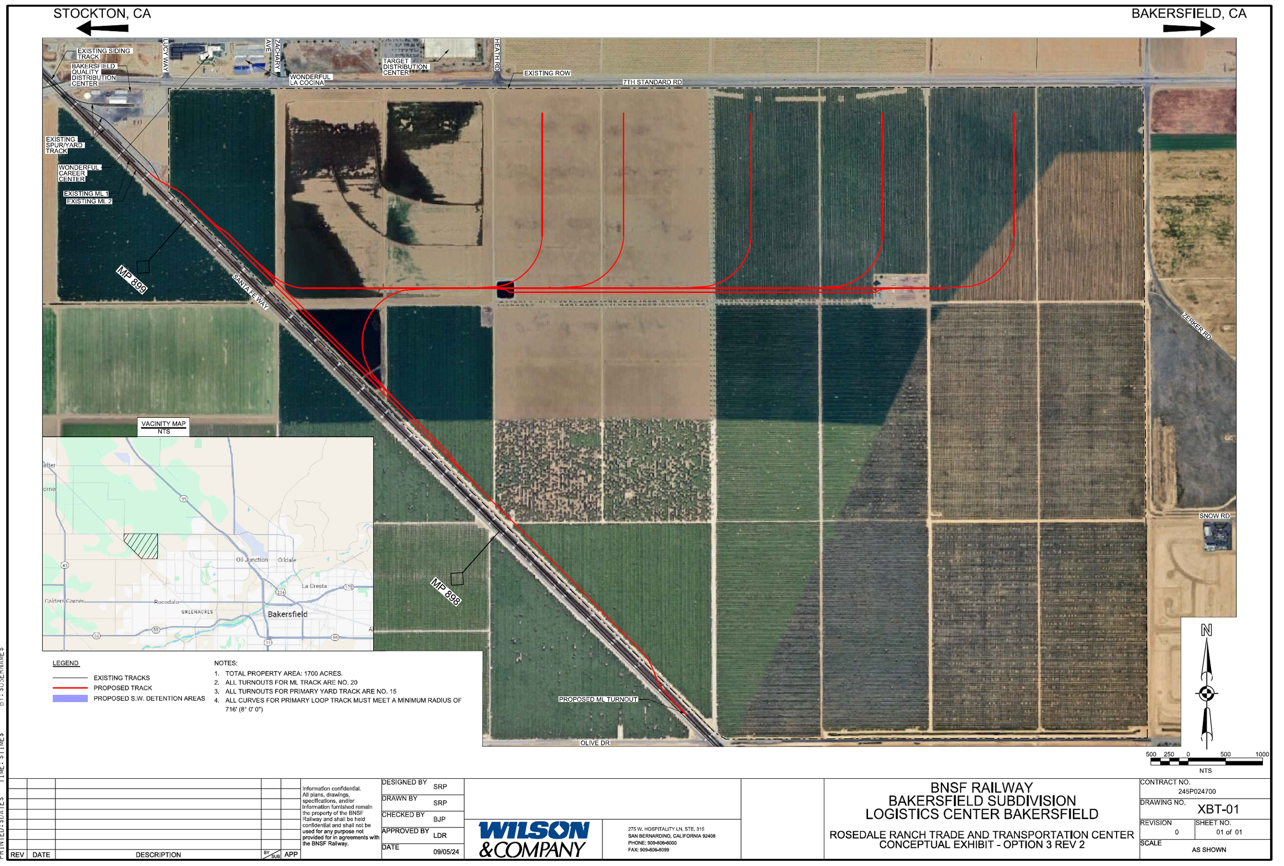 Aerial map showing proposed railway track routing through farmland in Bakersfield, California, with red lines indicating new track paths and existing railway lines.