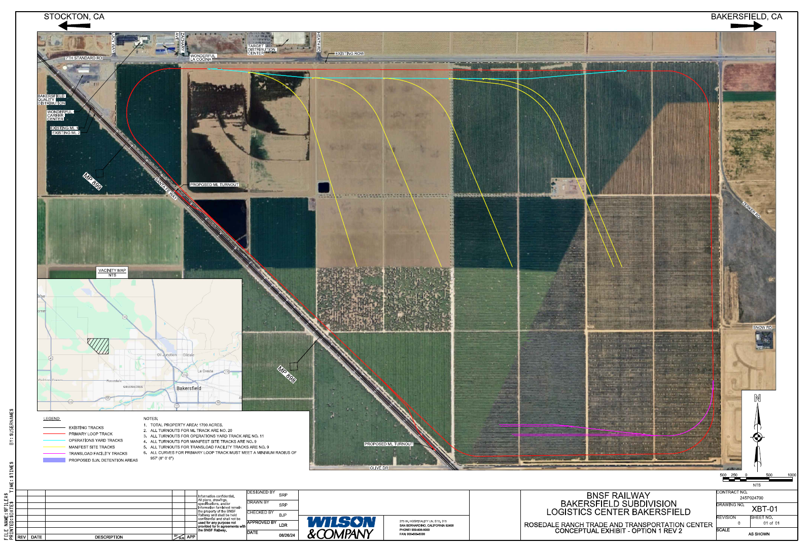 Aerial view schematic of a proposed rail yard near Bakersfield, California, showing existing and new tracks, property boundaries, and turnouts for logistics center development, with roads and fields surrounding the site.