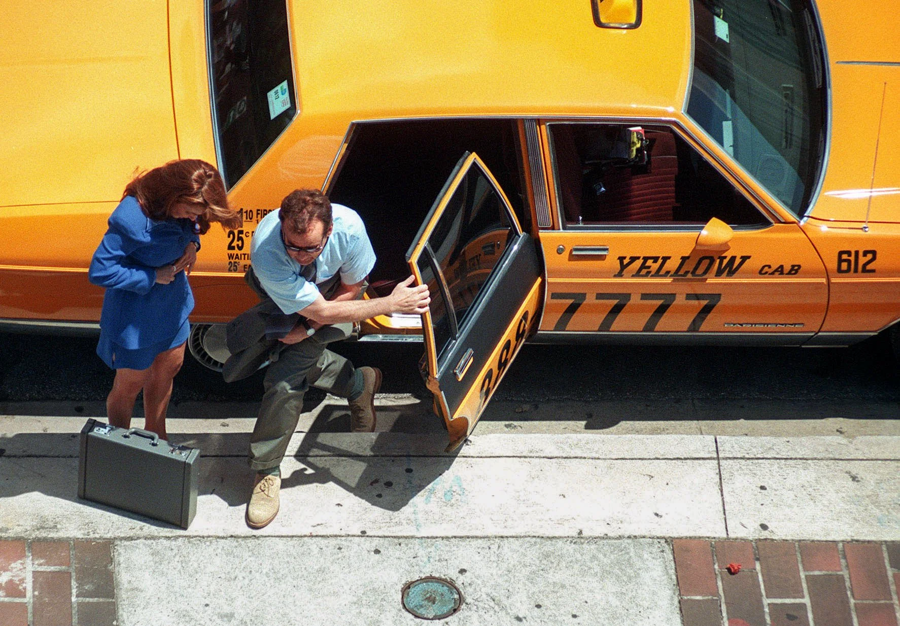 Bill Murray leaves a cab during the filming of Wild Things outside the Dade County Courthouse in Downtown Miami.
