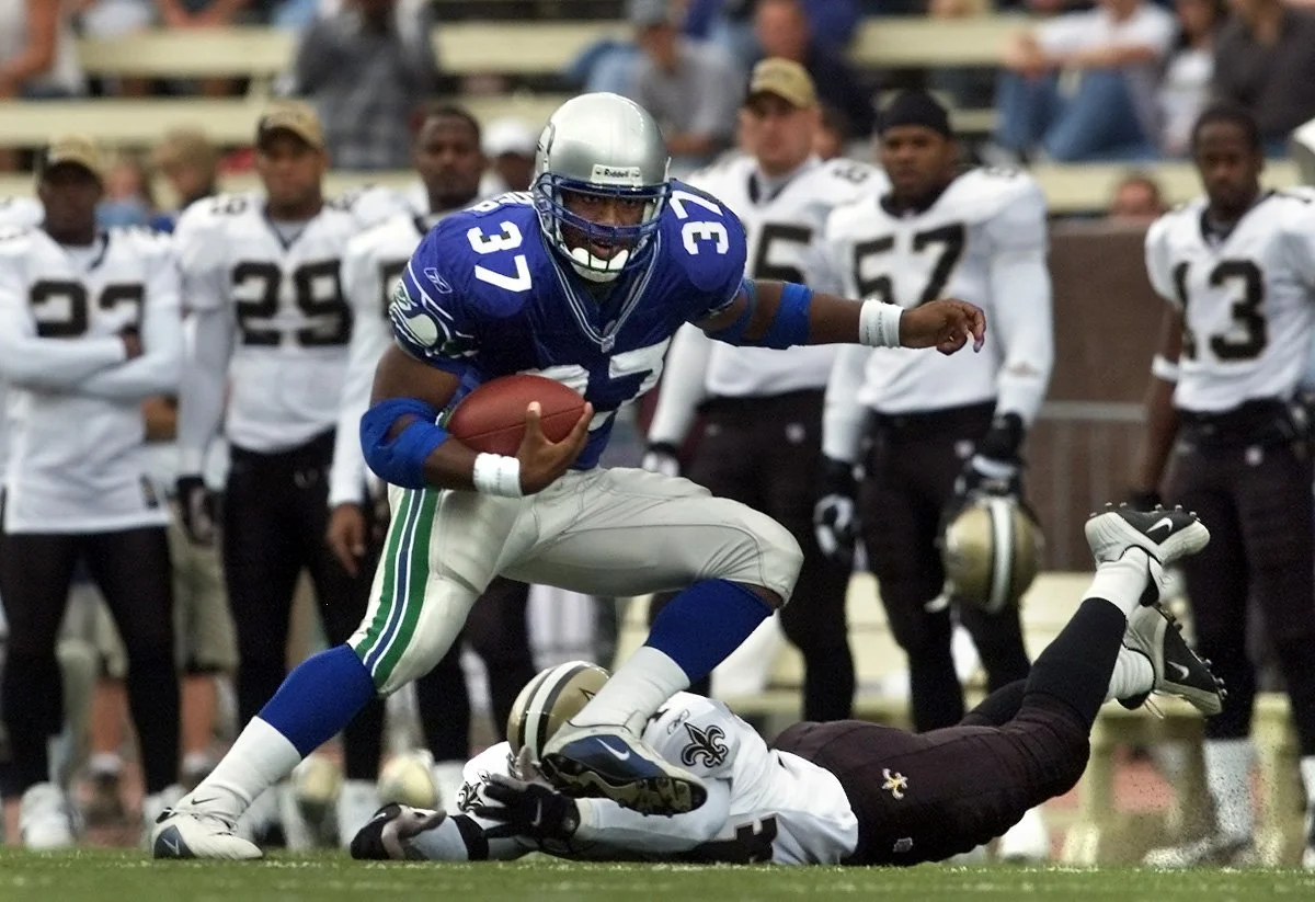 Seahawks running back Shaun Alexander breaks a tackle during a game against the New Orlean Saints in 2001.
