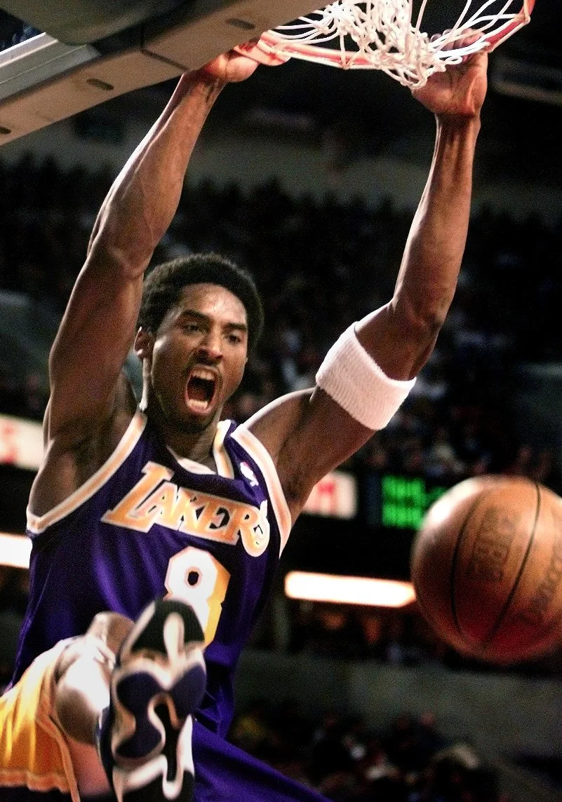 Los Angeles Laker Kobe Bryant dunks on the Seattle SuperSonics during game at Key Arena on Feb. 21, 1999.