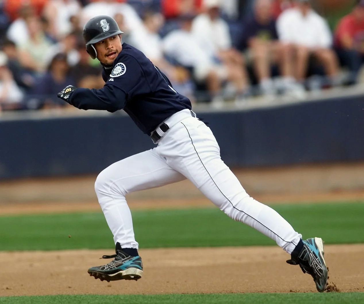 Seattle Mariner Ichiro Suzuki rounds the bases during a Cactus League game in Peoria, Arizona.