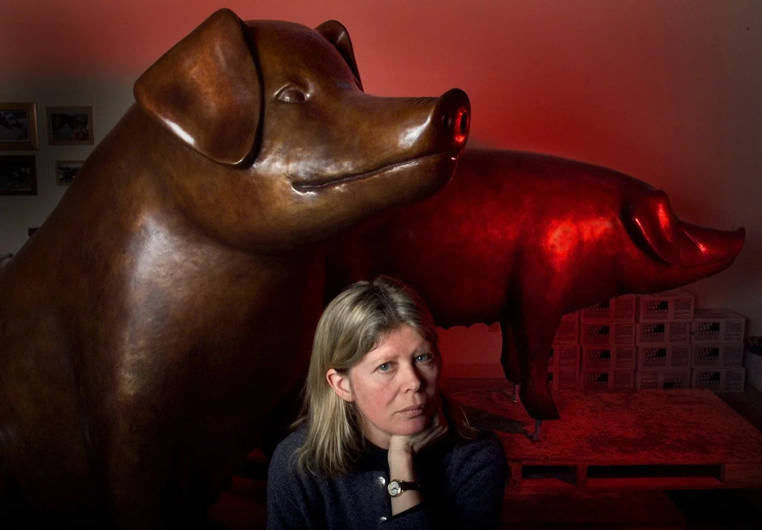 Bronze artist Georgia Gerber with her two larger-than-life pigs at her Clinton home and studio. The pigs will we be cast and duplicated for the “Pigs on Parade” art installation.