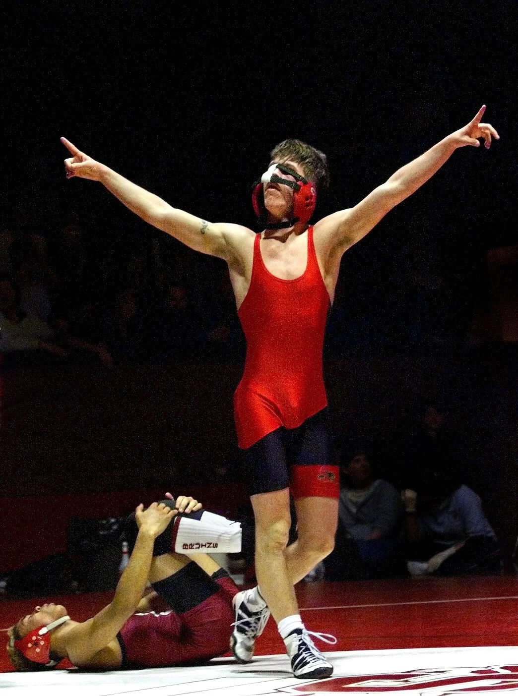 Snohomish wrestler Andy Aichele celebrates after pinning Cascades Jake France in the 130 lb. contest.