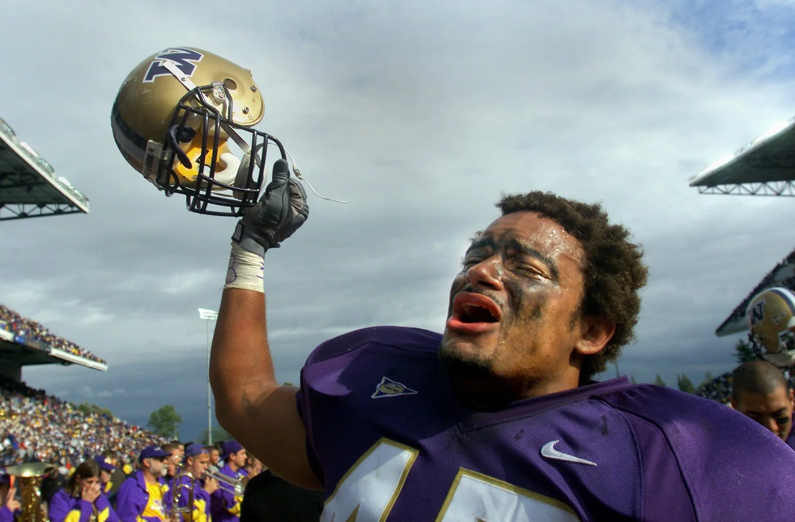 Washington linebacker Anthony Kelley sheds tears after leaving the field with a victory over the University of Miami at Husky Stadium