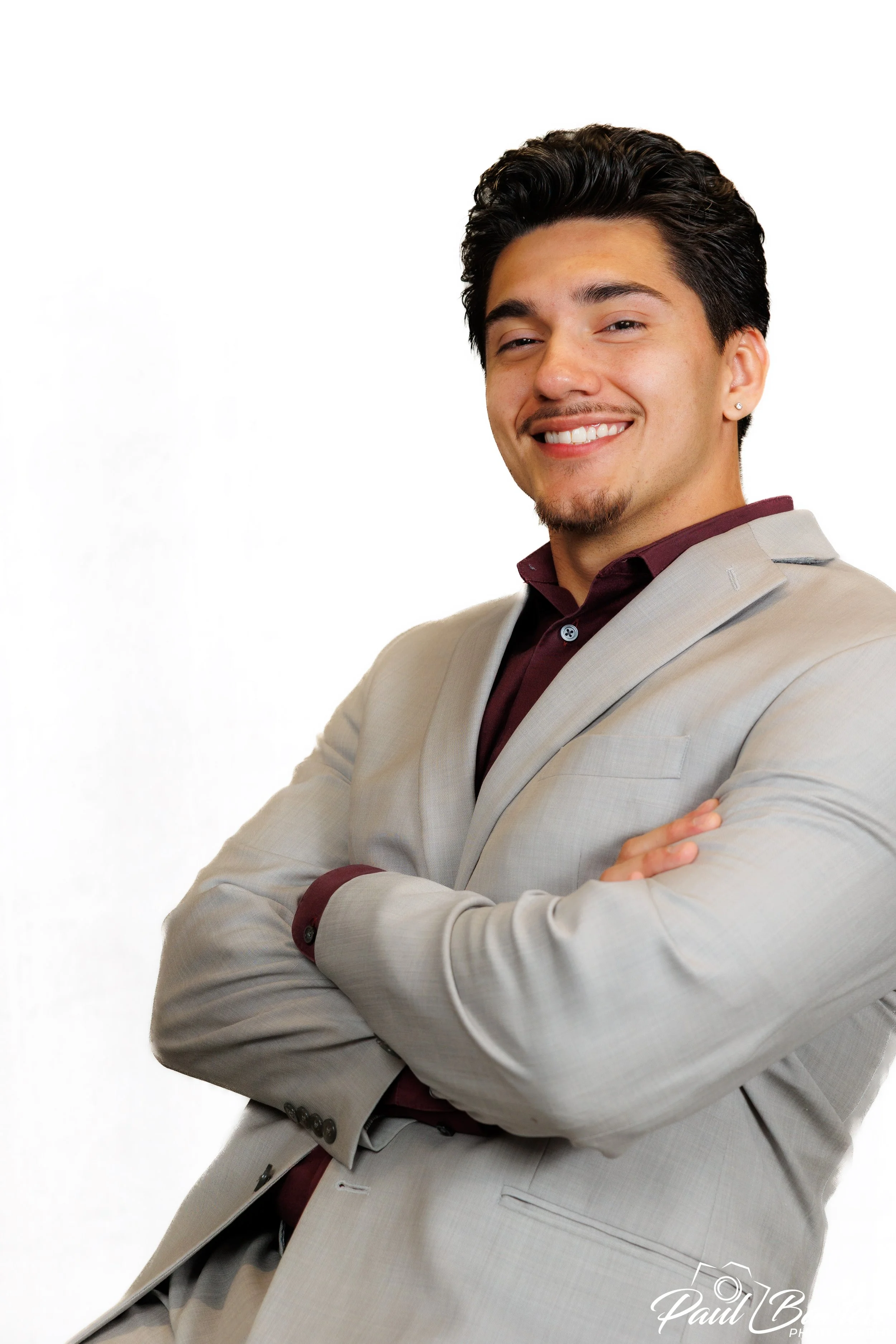 Headshot of a good looking man with a white background, taking at studio