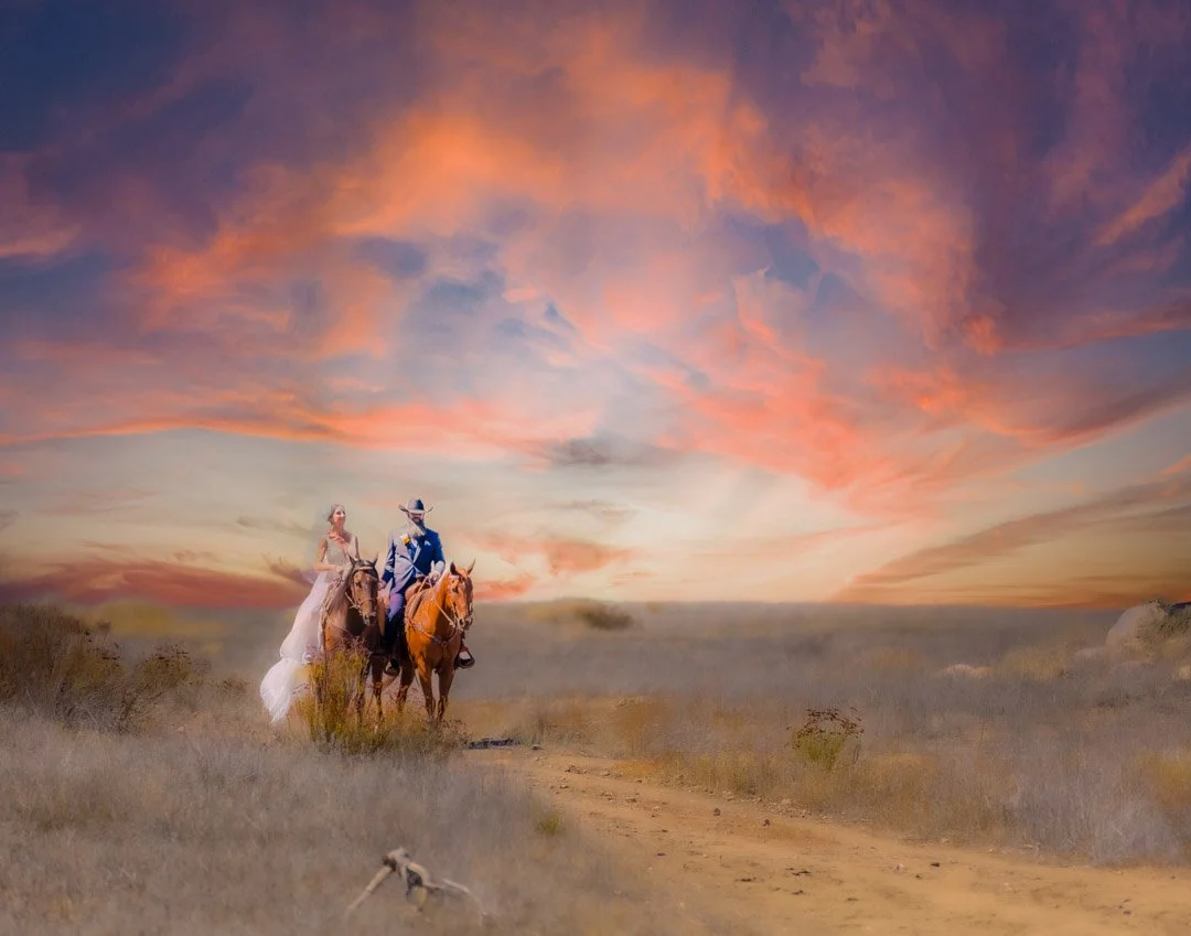 A wedding couple riding in on horses during the sunset at Menifee, California