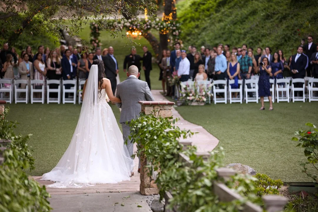 A father walk in his daughter down the aisle at their wedding in Fallbrook, California