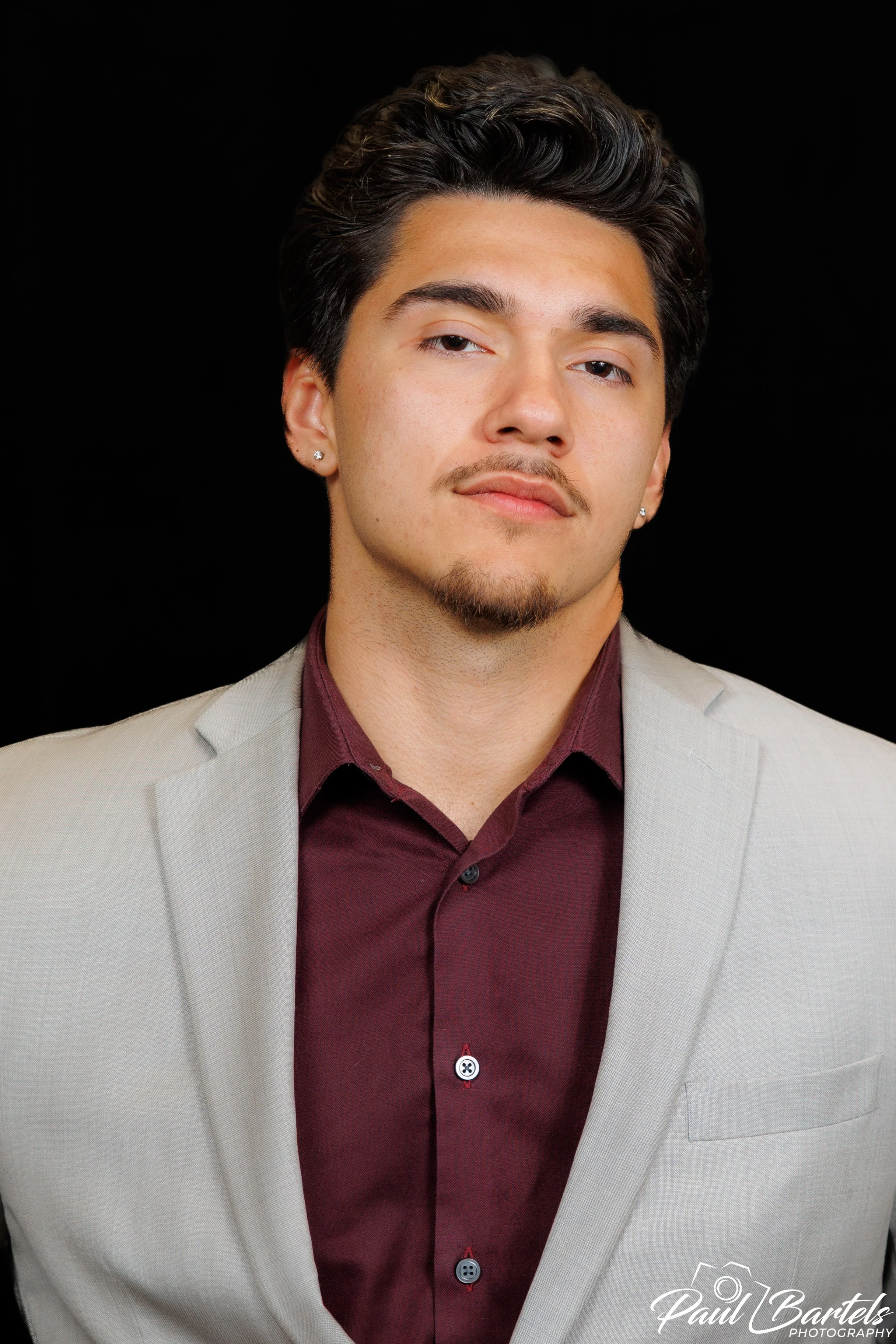 Studio headshot with black background