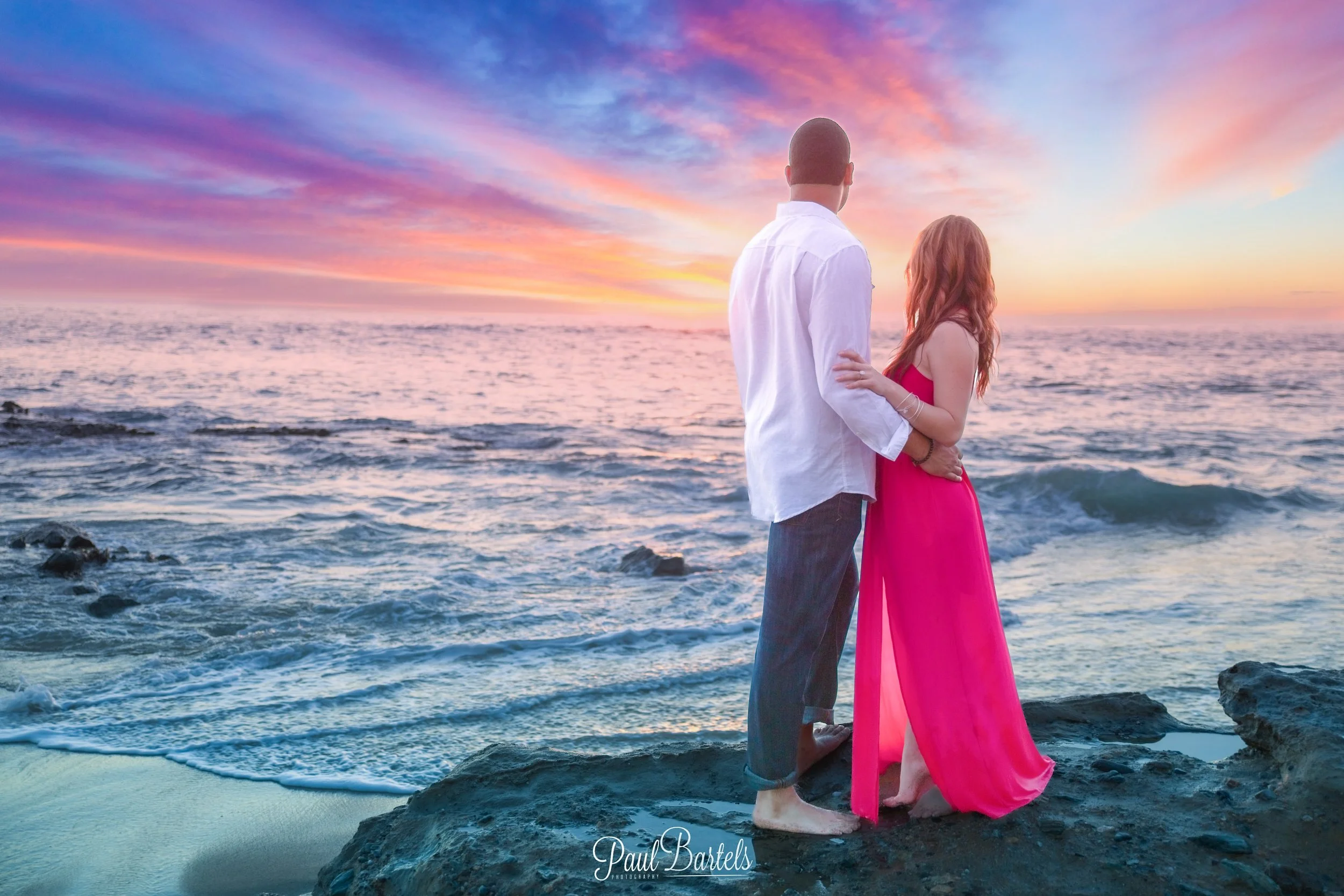 Couple watching the sunset in Laguna Beach