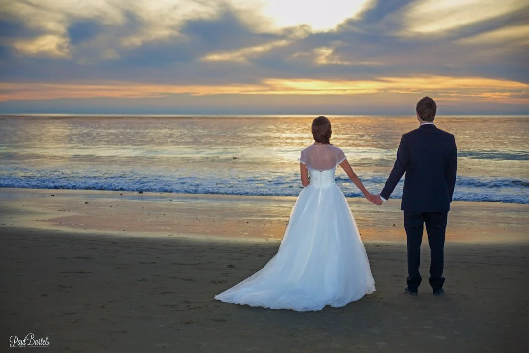 bride and groom looking at Ocean in Laguna beach.jpg
