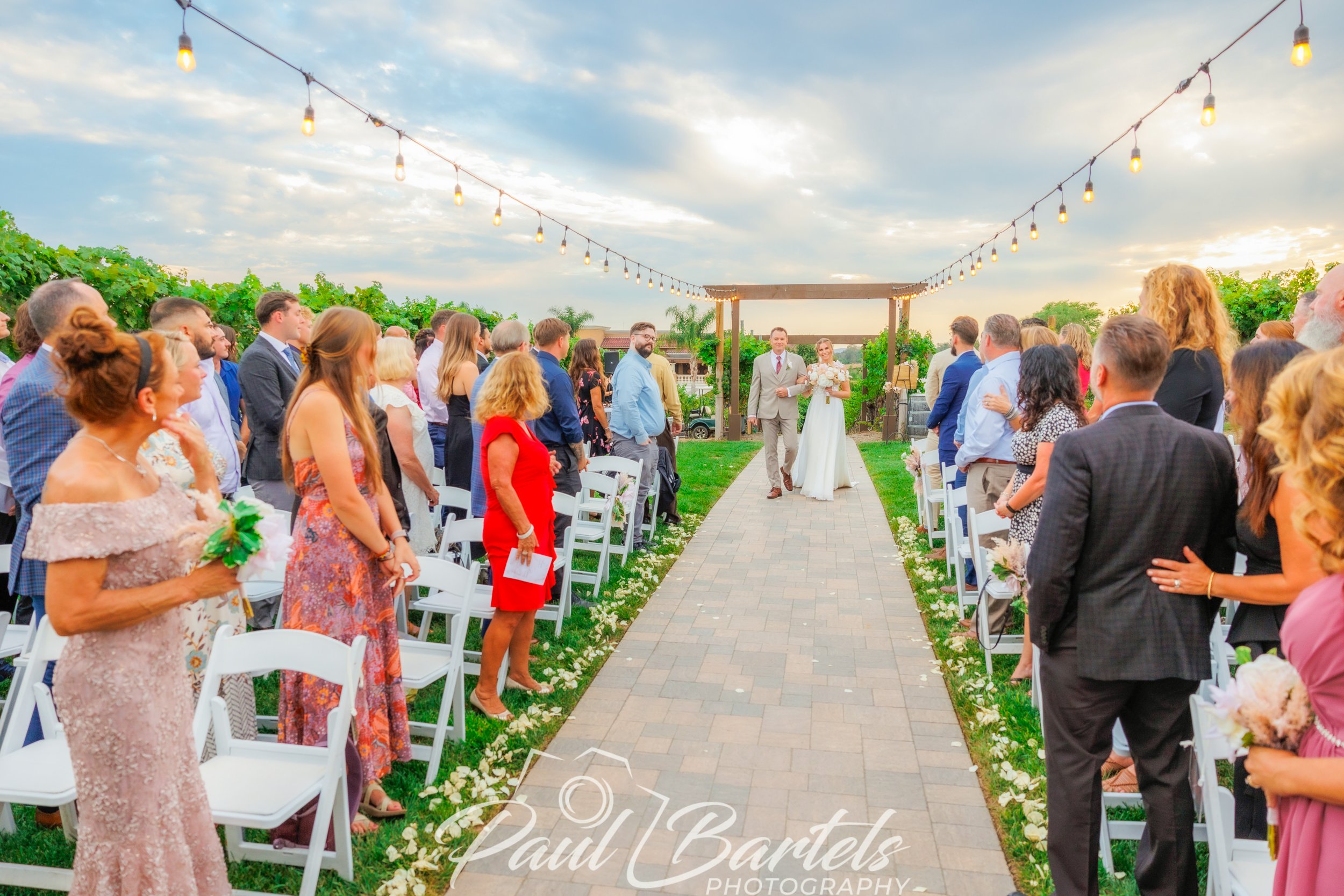 Bride and groom walking down the isle in Dana Point California photograph by Paul Bartels photography