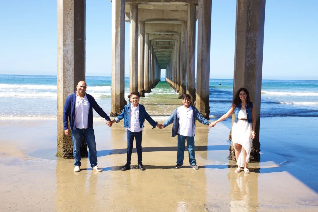 Temecula-family-photographer family beach photo taken by the pier in Huntington Beach, California.jpg