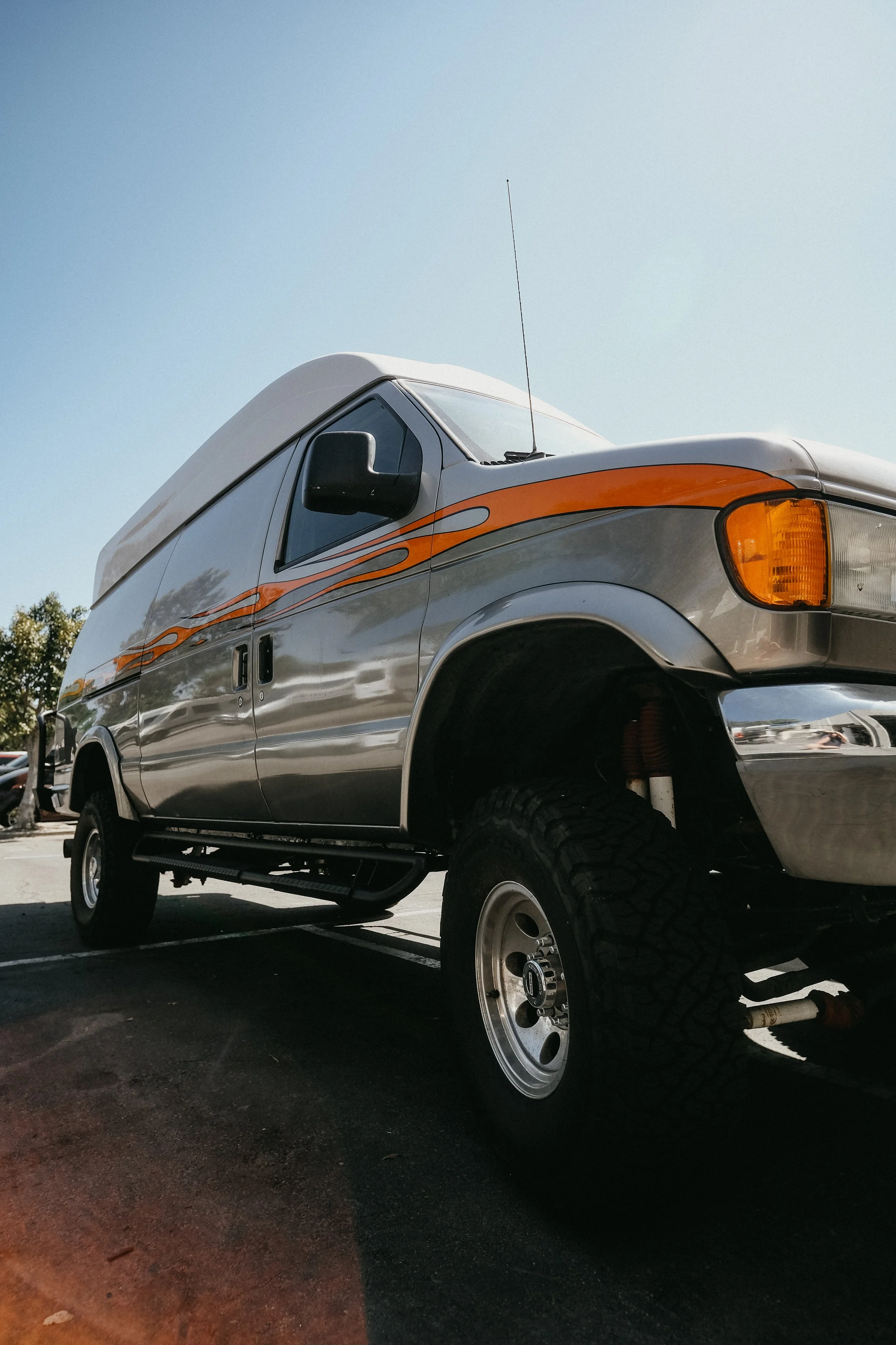Close up of a lift kit and new tires on a ford transit