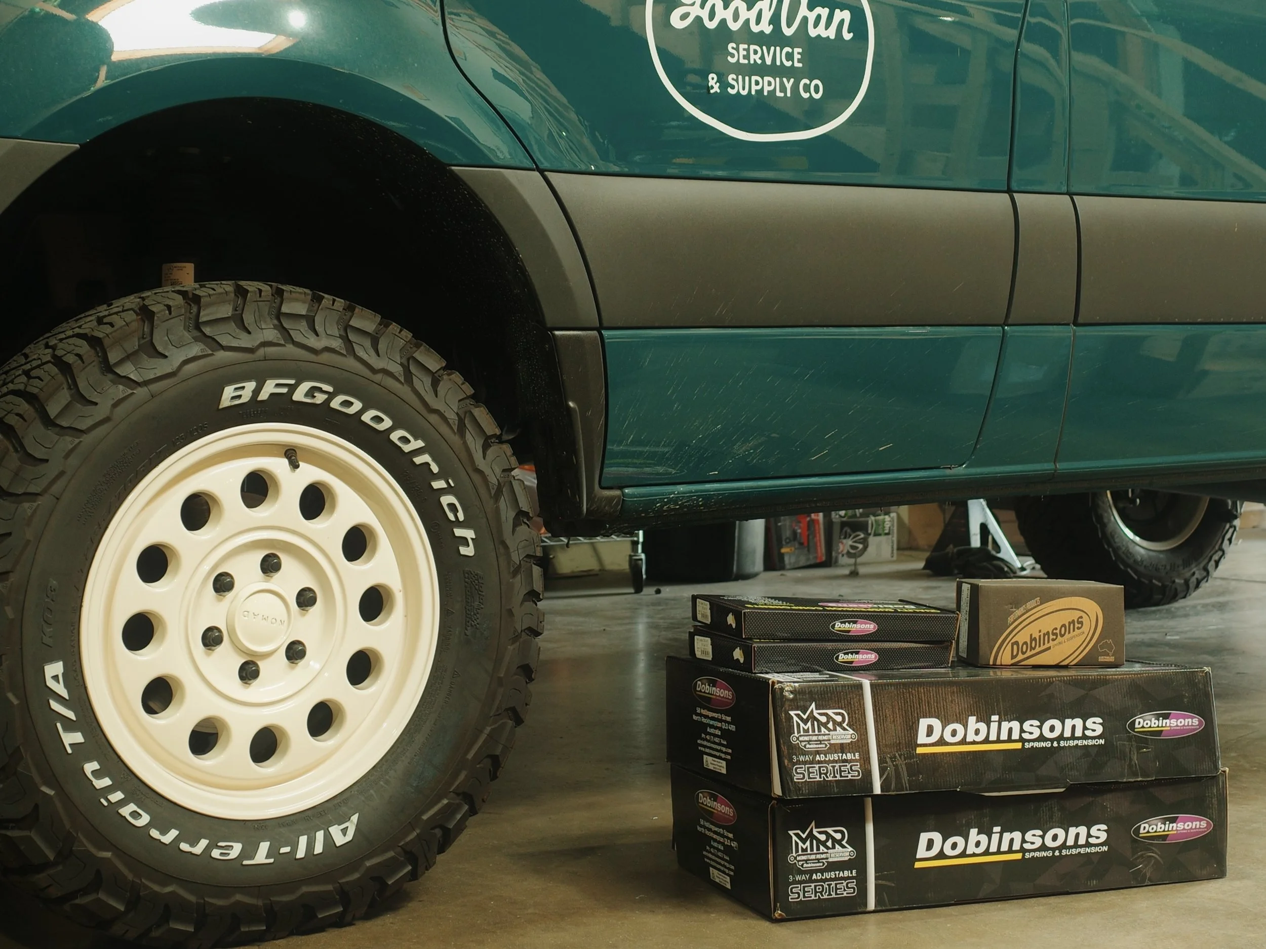Dobinsons MMR suspension in front of Mercedes Sprinter van with nomad wheels and BF Goodrich tires