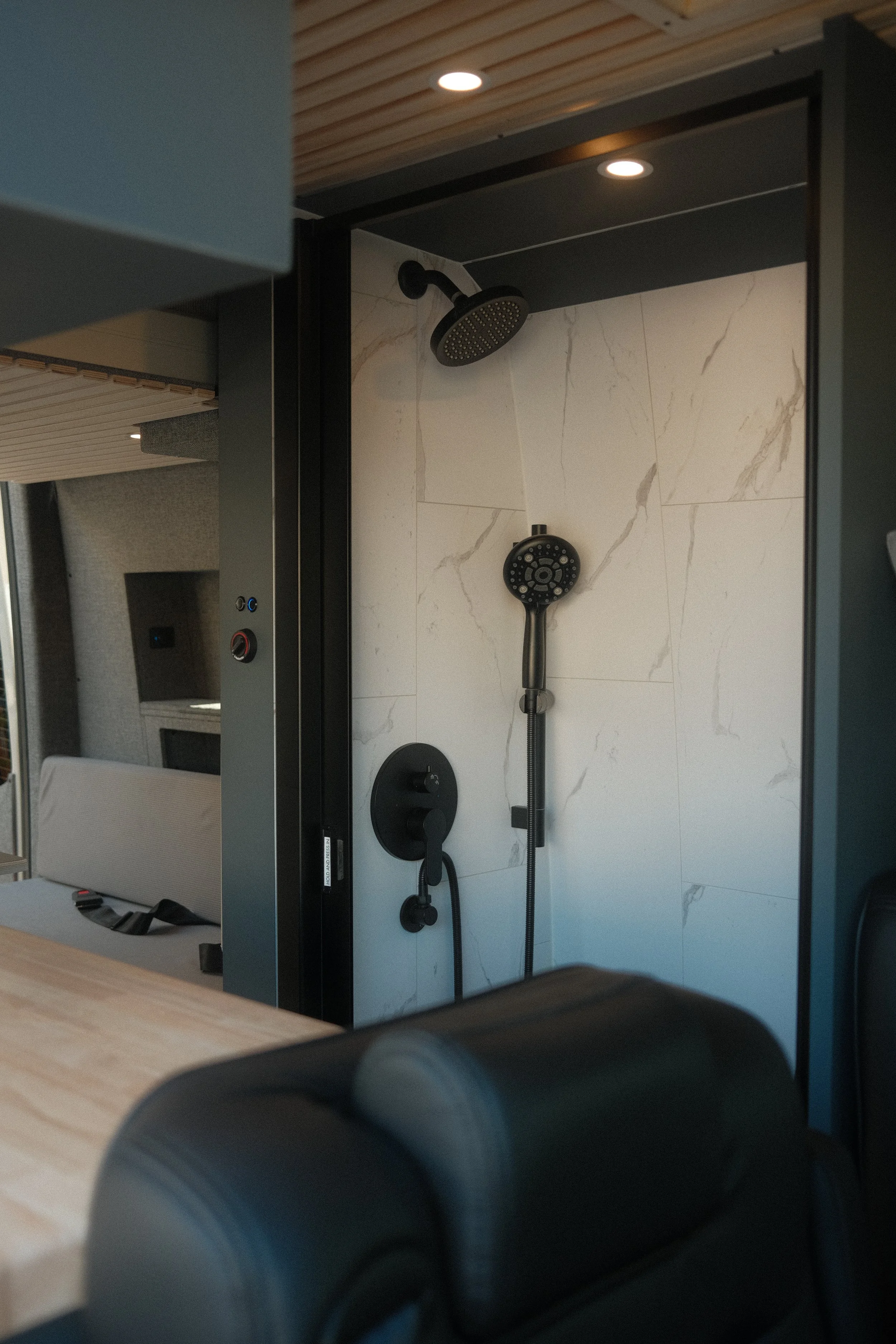 Close up of a shower inside a custom interior build for a mercedes sprinter van