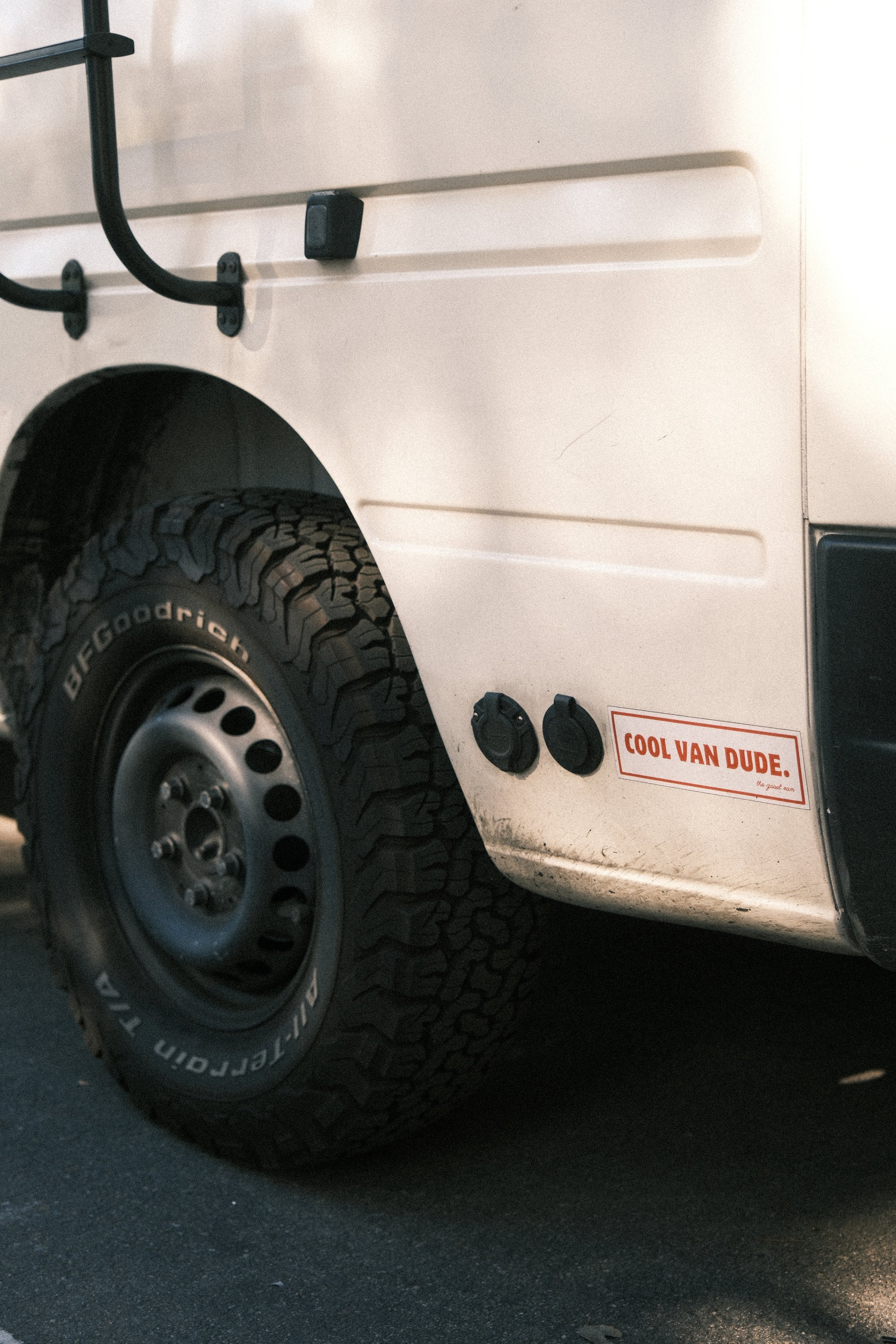Close up of a lift kit and tires on a Mercedes sprinter can and access to the water pump