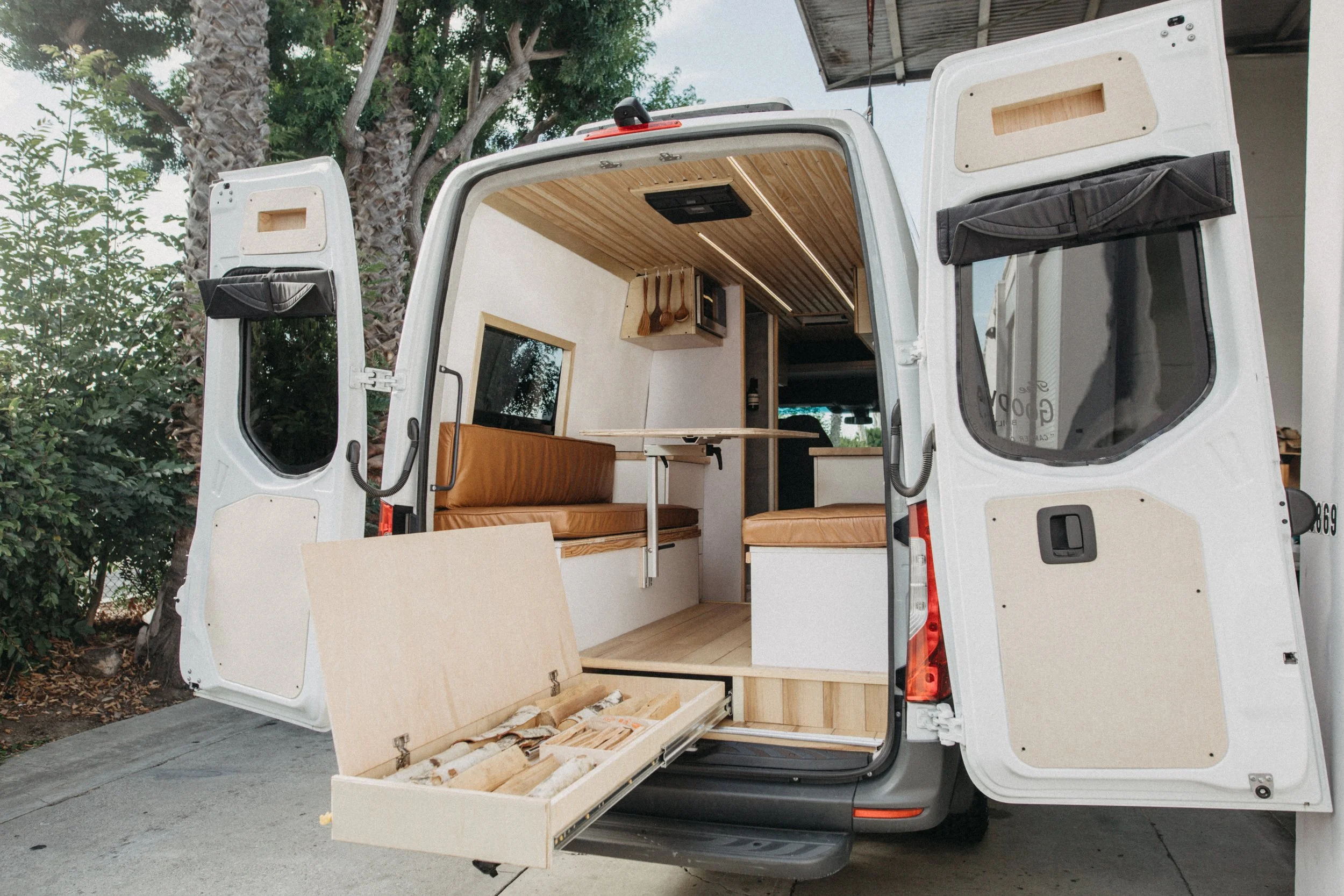 Premium Sprinter conversion garage area showcasing clean utility integration and maximum storage.