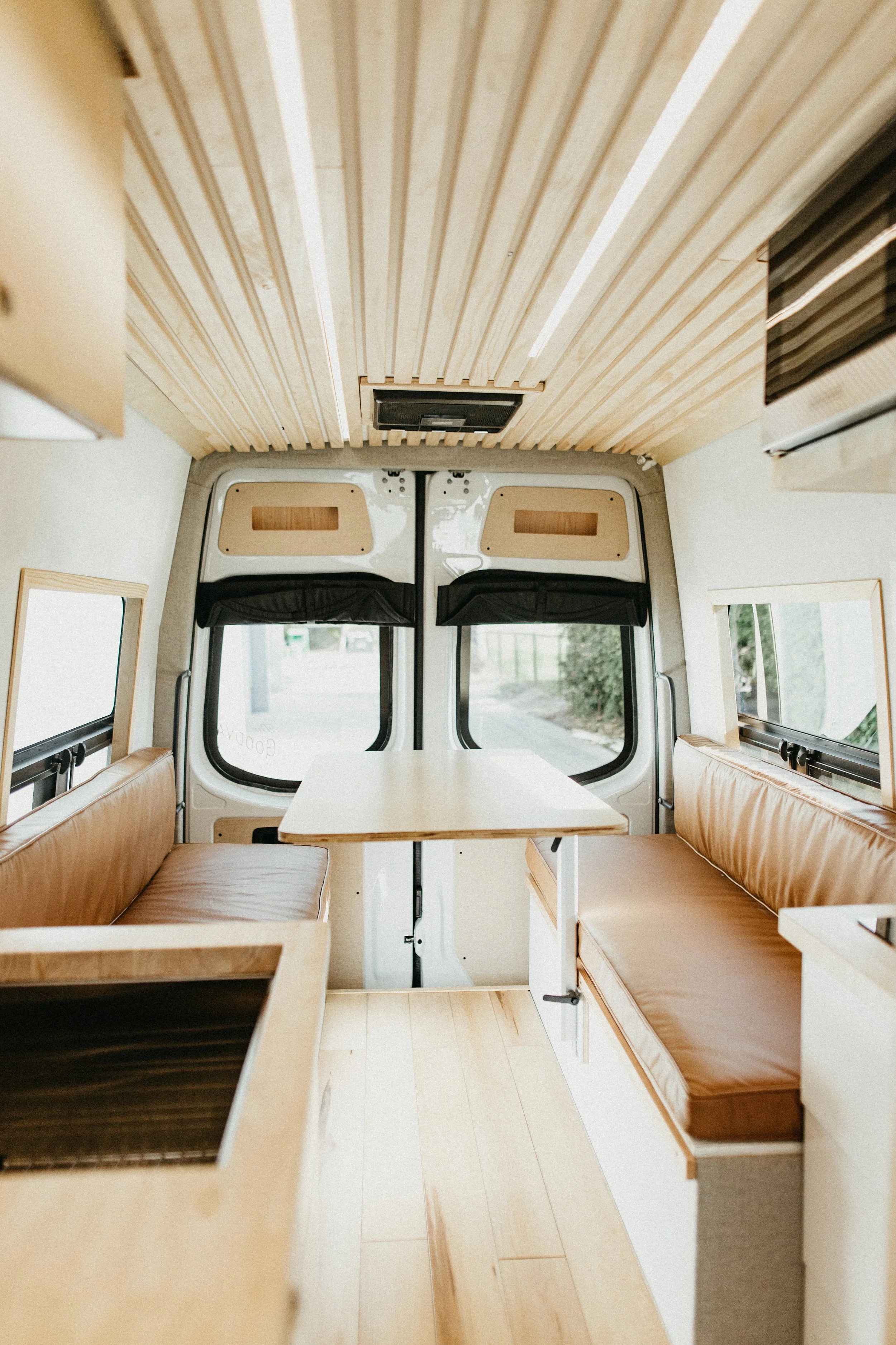 Custom Mercedes Sprinter conversion showcasing bespoke modular interior kit integration.