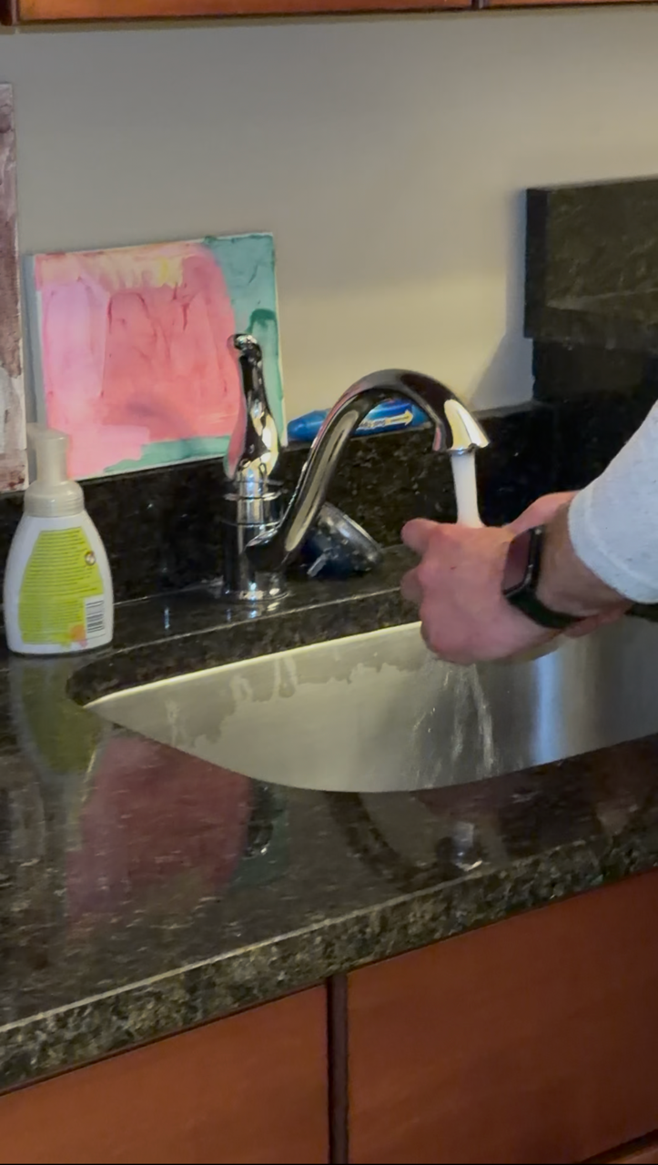 Running the kitchen sink during a home watch visit.
