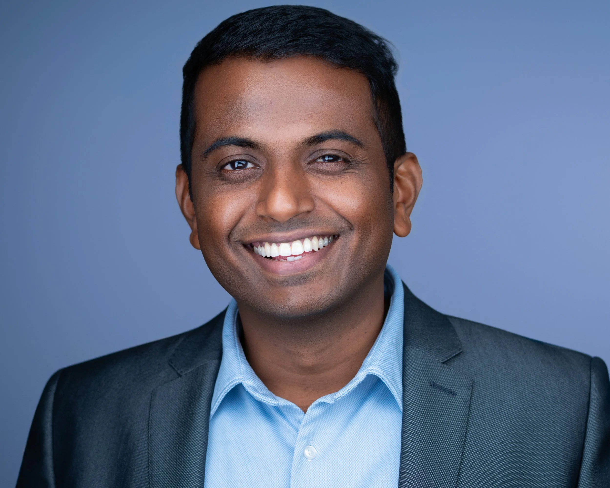 Male marketing executive headshot in NJ utilizing expert studio lighting to stand out, by Eclipse Headshots.