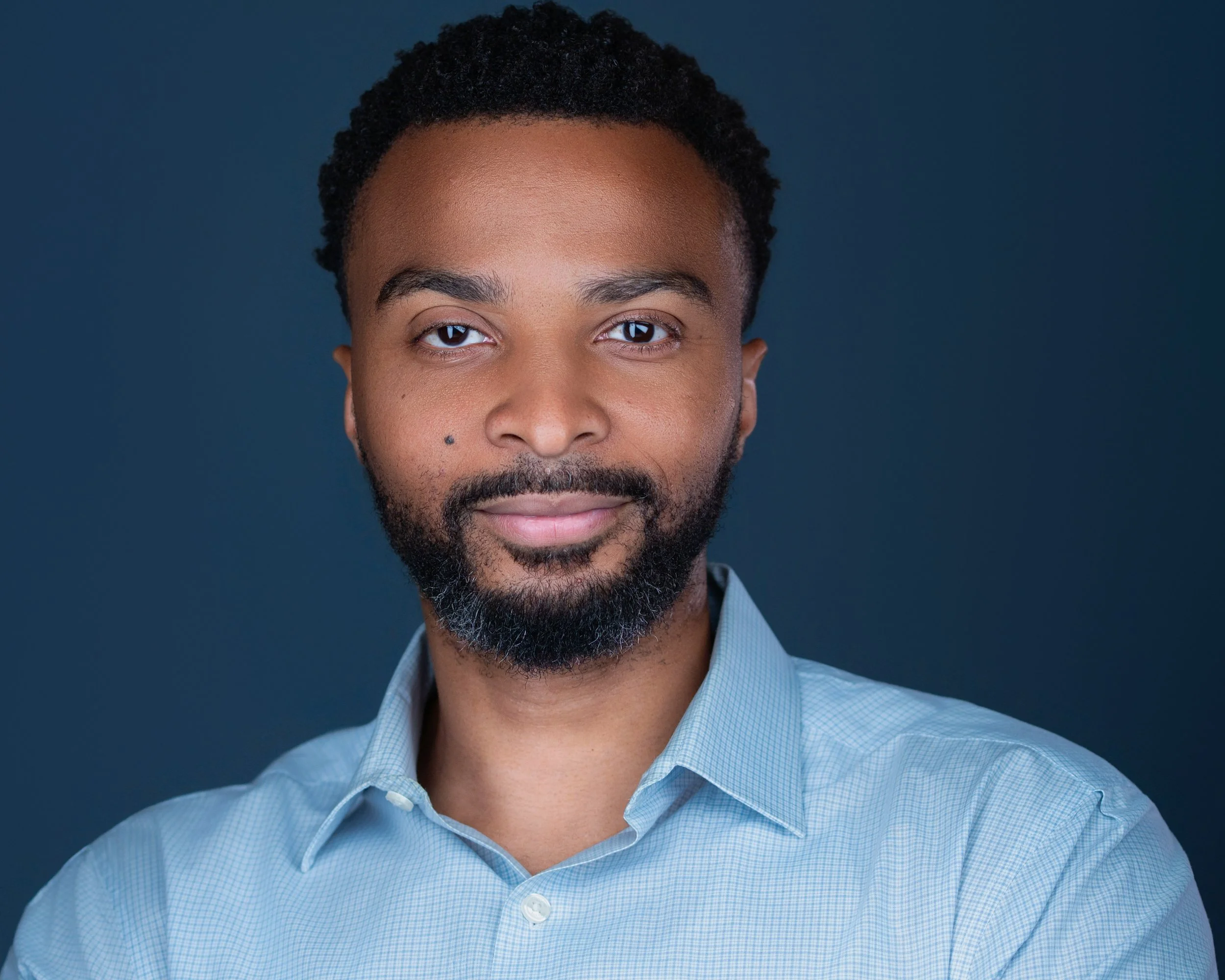 Studio quality men's professional portrait in NY with expert lighting to eliminate camera anxiety.