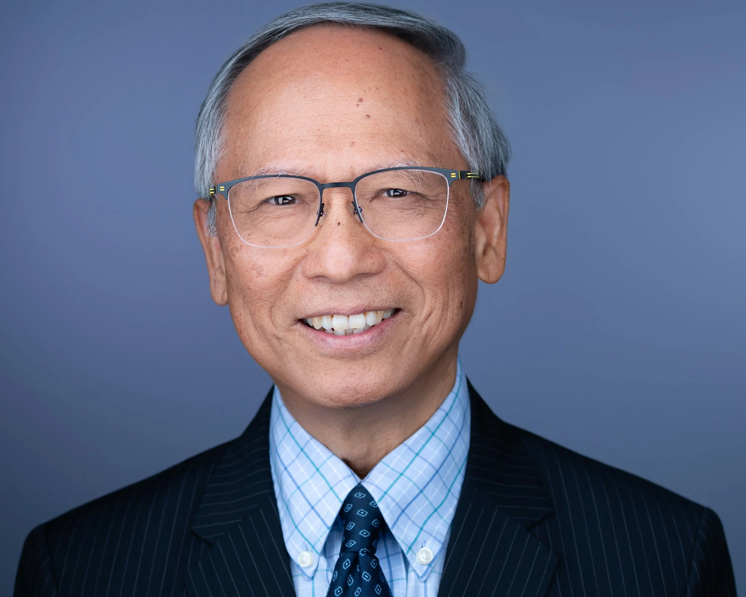 Confident CEO headshot in NJ & NY with an approachable smile, designed to showcase leadership and build trust, by Eclipse Headshots.