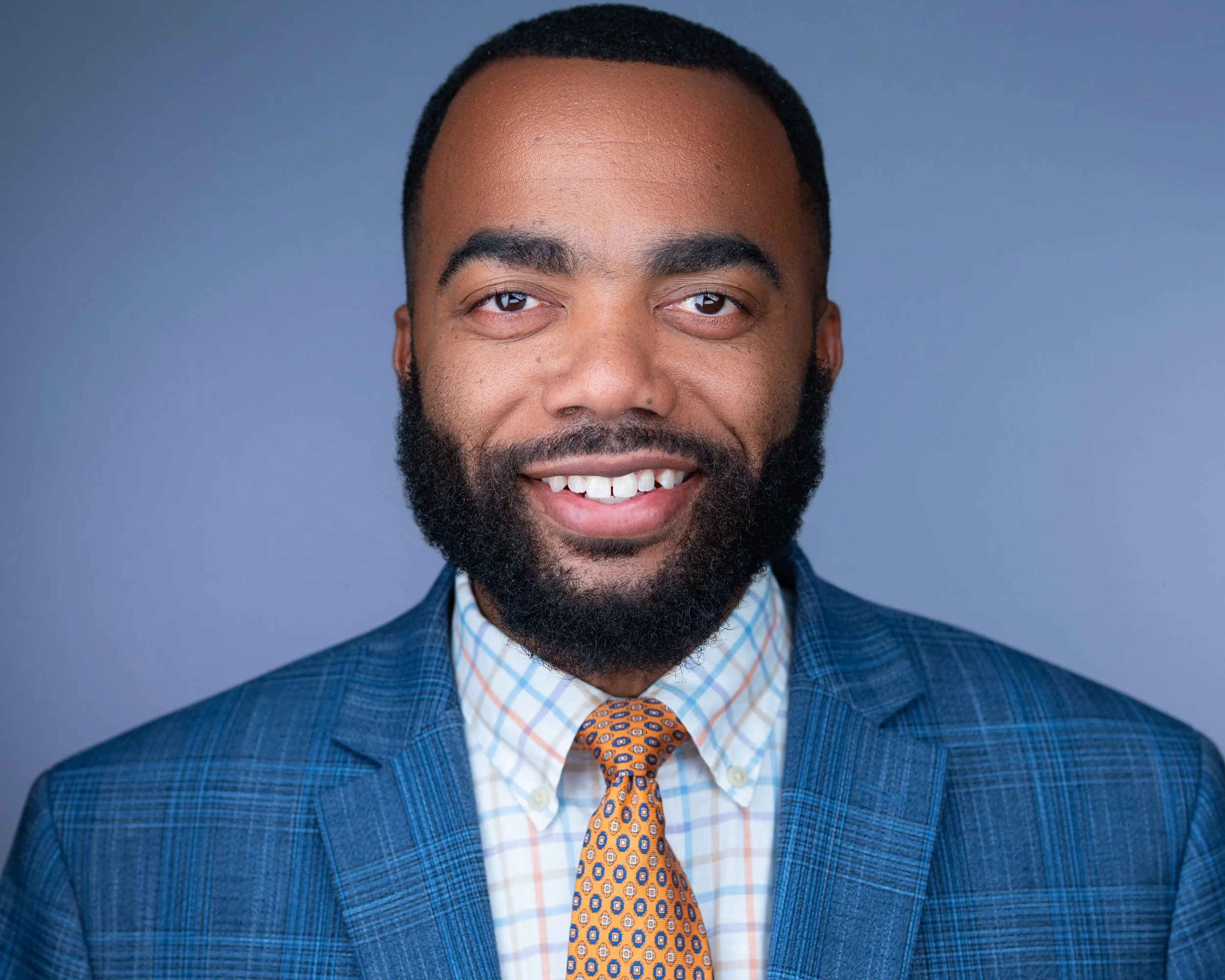 Professional profile photo for a male attorney in NY, capturing an authentic and trustworthy expression.