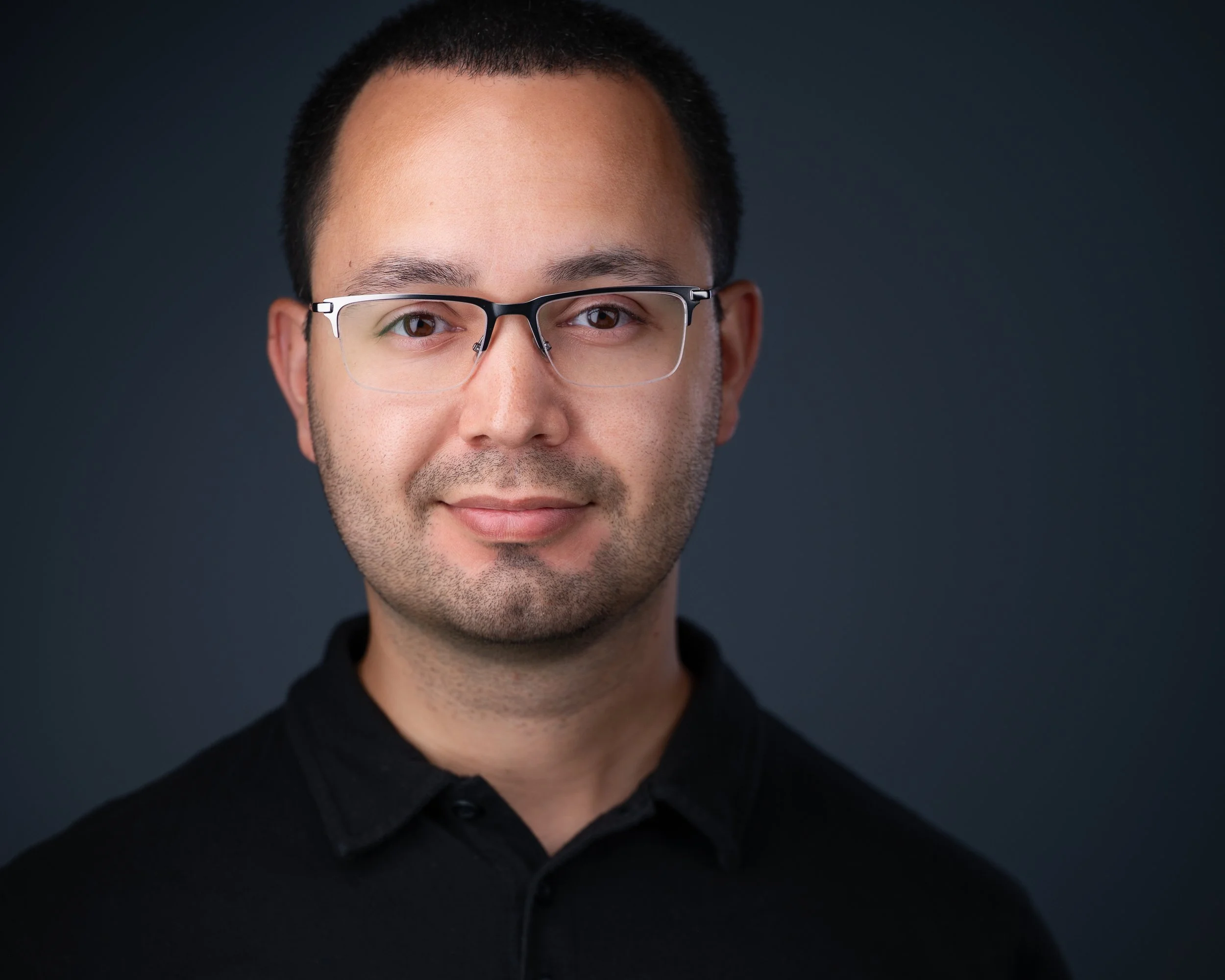 Professional headshot of Jon Larrazabal, founder of Eclipse Headshots in NJ, specializing in expression coaching and corporate photography.