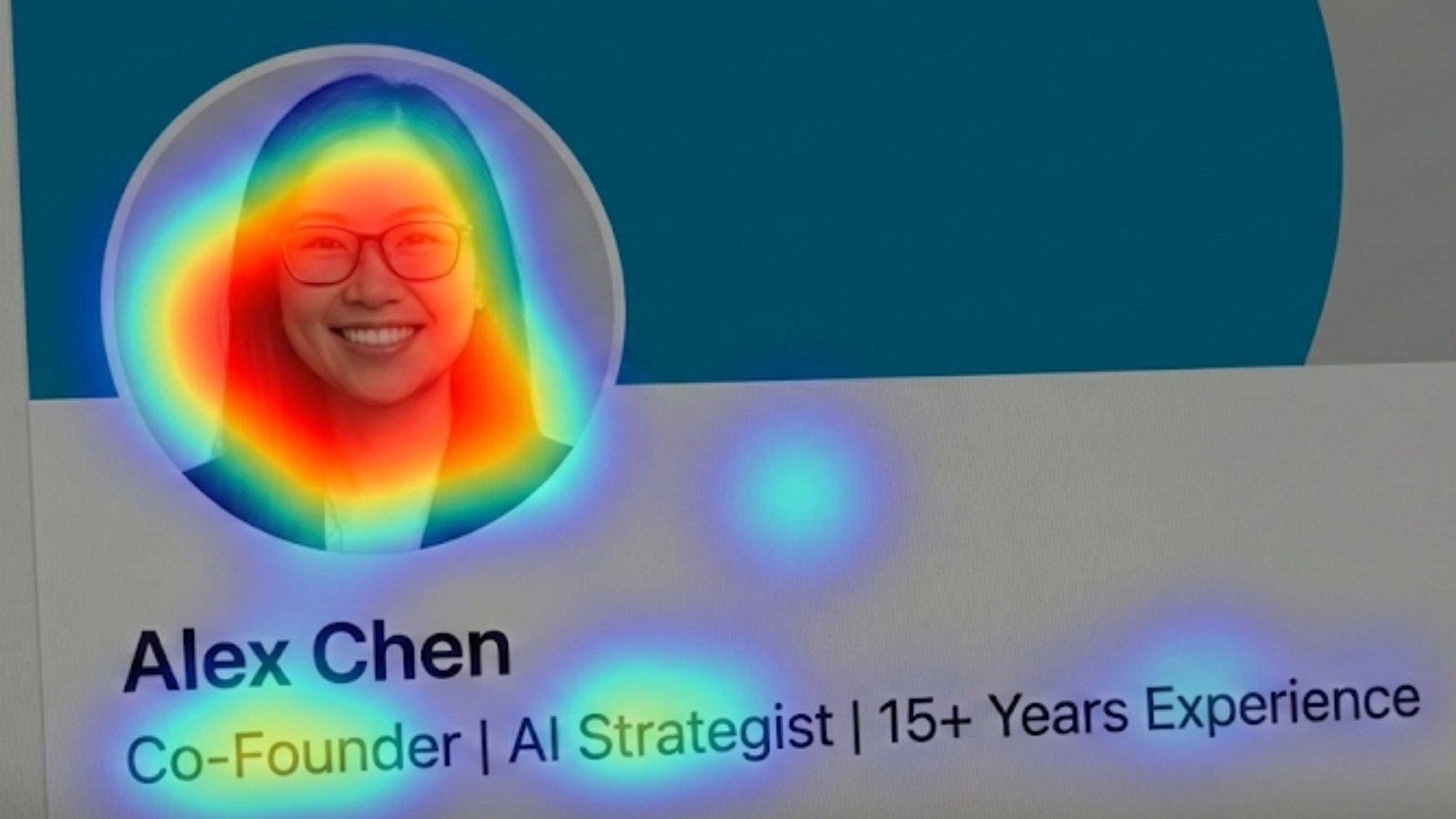 Eye-tracking heatmap of a LinkedIn profile showing intense visual attention concentrated on the face. The red 'hot spots' confirm that viewers look at the headshot first, before reading the headline or experience.