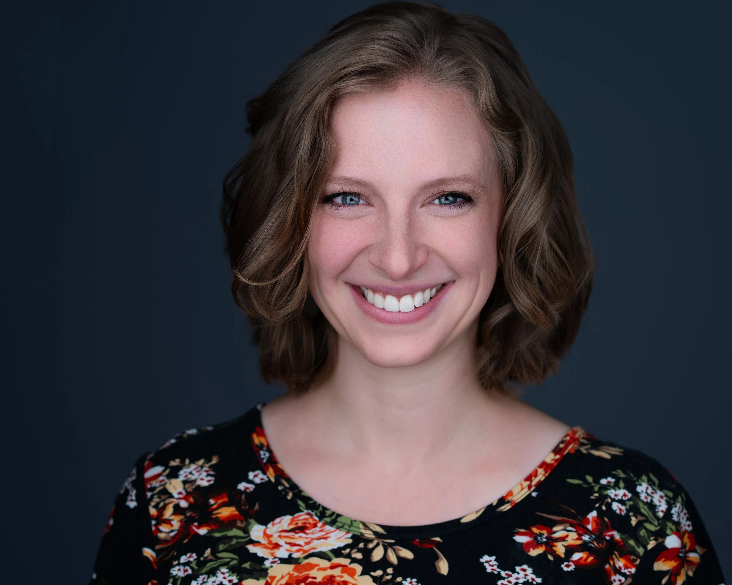Polished business portrait of a woman using professional studio lighting in NJ & NY to elevate her brand.