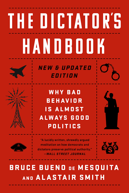 Cover of 'The Dictator's Handbook' book with red background, black icons of a jet, radio tower, handcuffs, speaker, man at podium, and money bags, and text including 'New & Updated Edition' and authors Bruce Bueno de Mesquita and Alastair Smith.