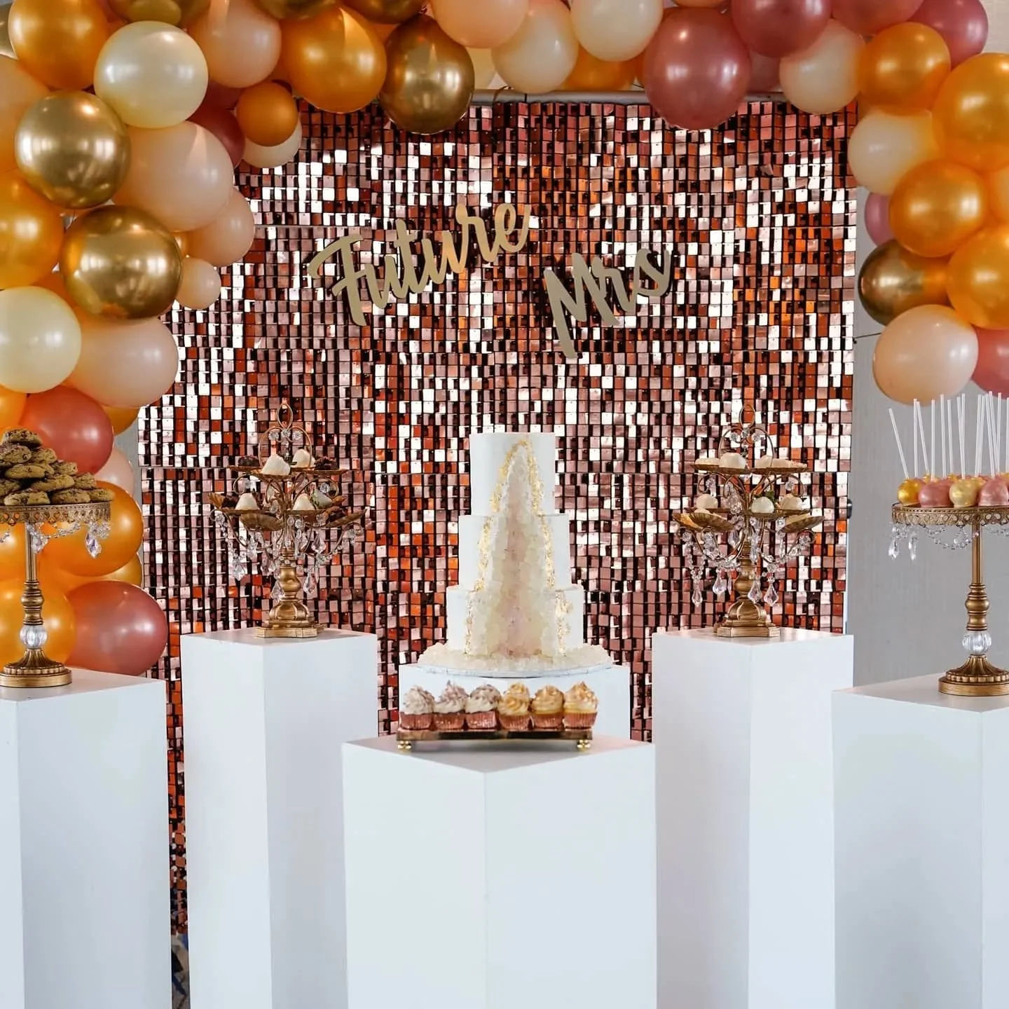 A custom curated sweets table layout for a bridal shower, with an assortment of Chocolate Chip Cookies, Chocolate Strawberries, Cupcakes, and Cake Pops. We love creating custom sweets table spreads for our clients, it's a chance to be a little extra 
