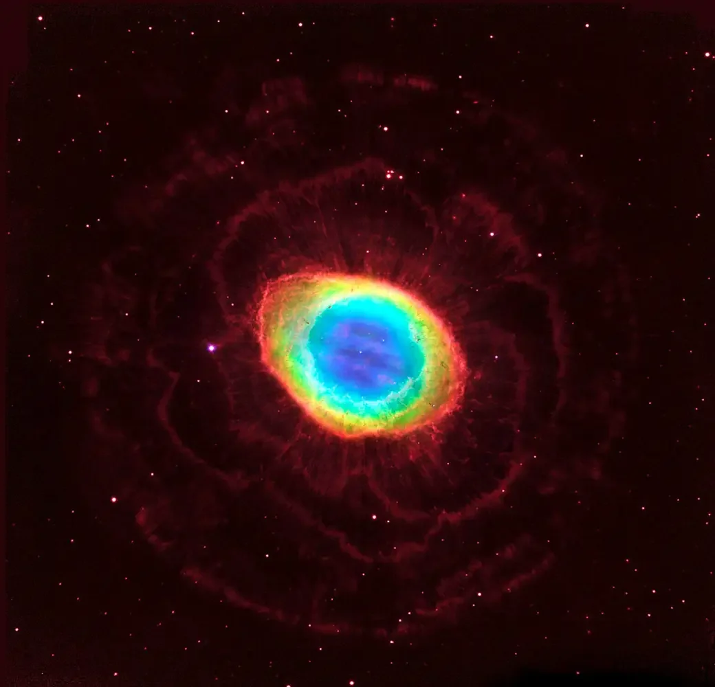 Colorful nebula with vivid rainbow-like rings, set against a background of stars.