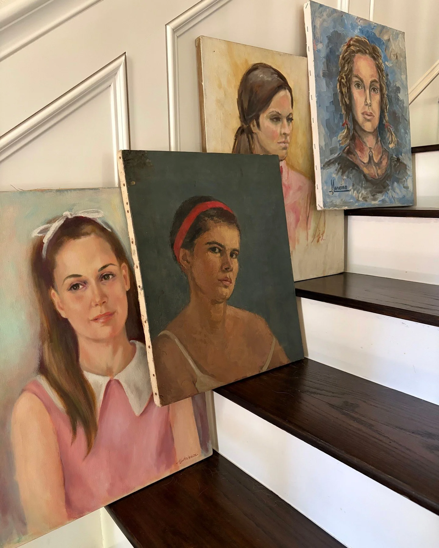 Four young faces rendered by the hands of four artists. Four still moments captured in portrait, waiting for new walls.