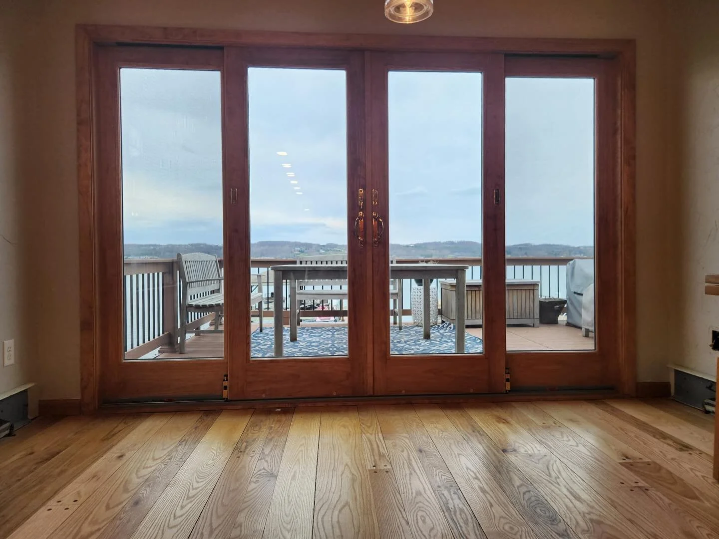 New door installed just in time to watch the snow come down in April , apparently! 
❄️
We&rsquo;re so proud of this install, with a gorgeous door from @andersen_windows looking right out onto the lake, perfect for letting in the evening breeze or let