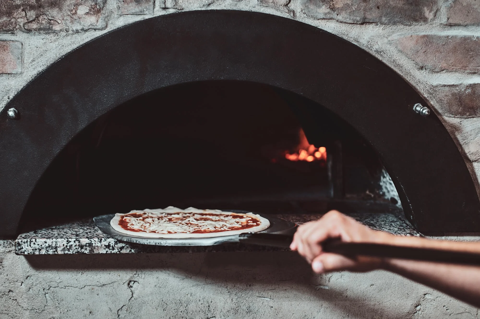 italian-chef-is-putting-prepared-margarita-pizza-oven-with-flame-it.jpg