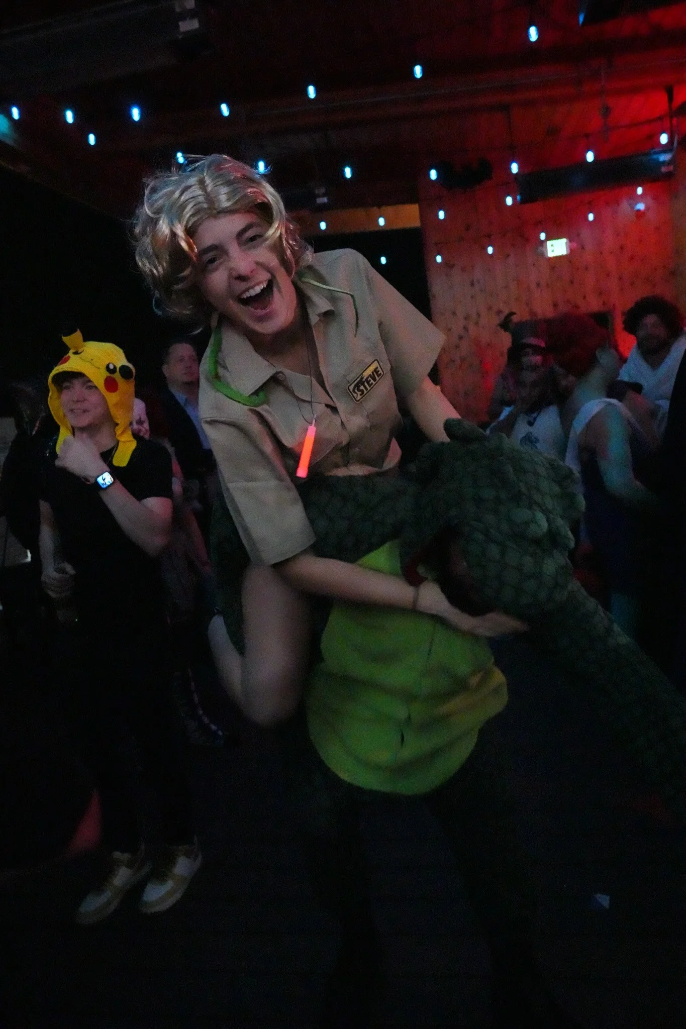 Couple dressed as Steve Irwin and crocodile at halloween party