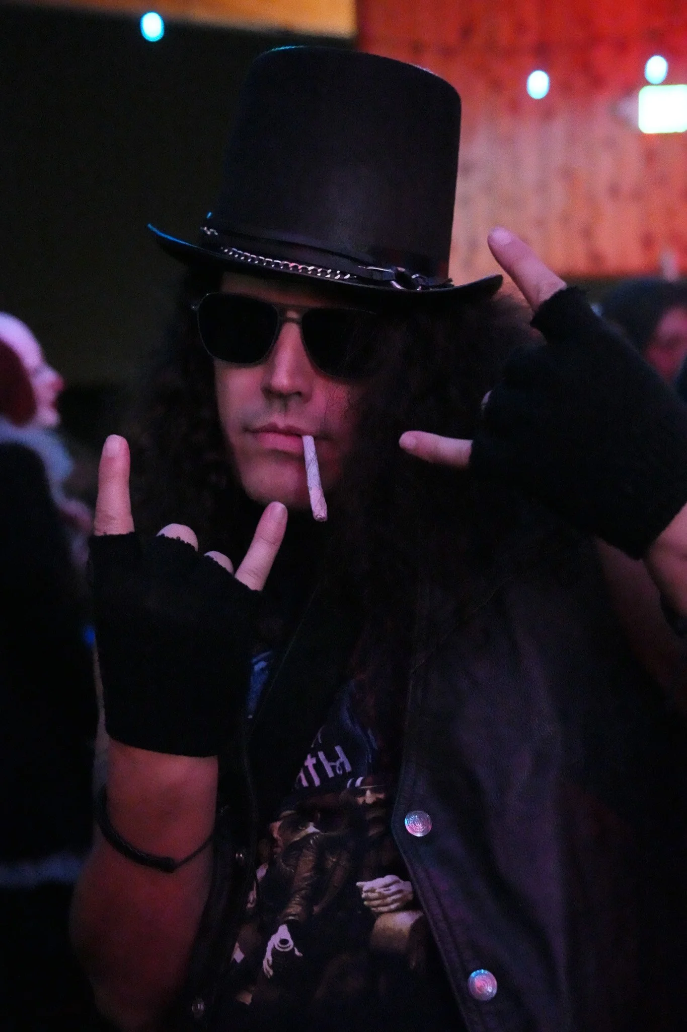 Man dressed as Slash at a halloween party