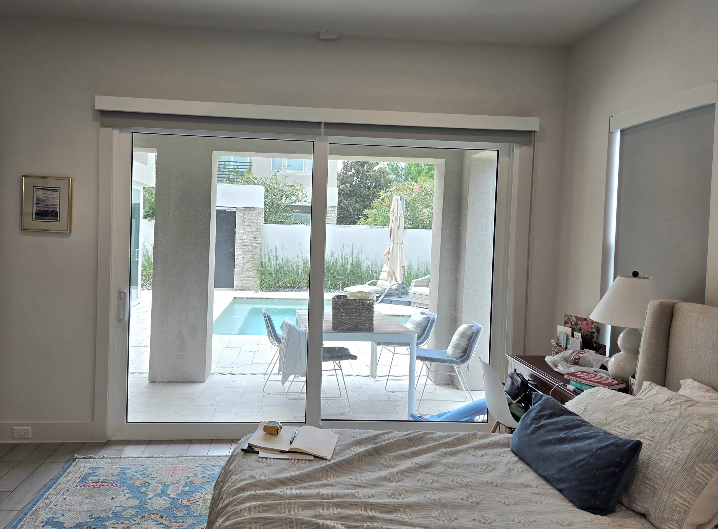 Before picture of bedroom without drapery or bedcovering to be used for a budget design package interior design project.