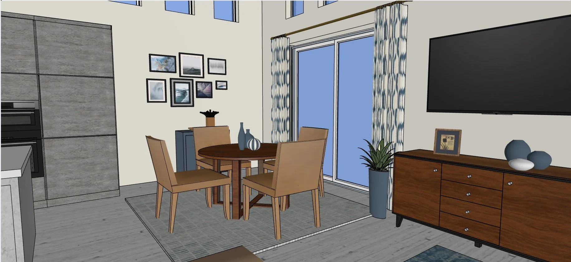 Interior view of a modern living room with a round wooden dining table and four beige chairs, a flat-screen TV mounted on the wall, a wooden sideboard with decor items, a potted plant, framed pictures on the wall, and sliding glass doors with patterned curtains leading outside.