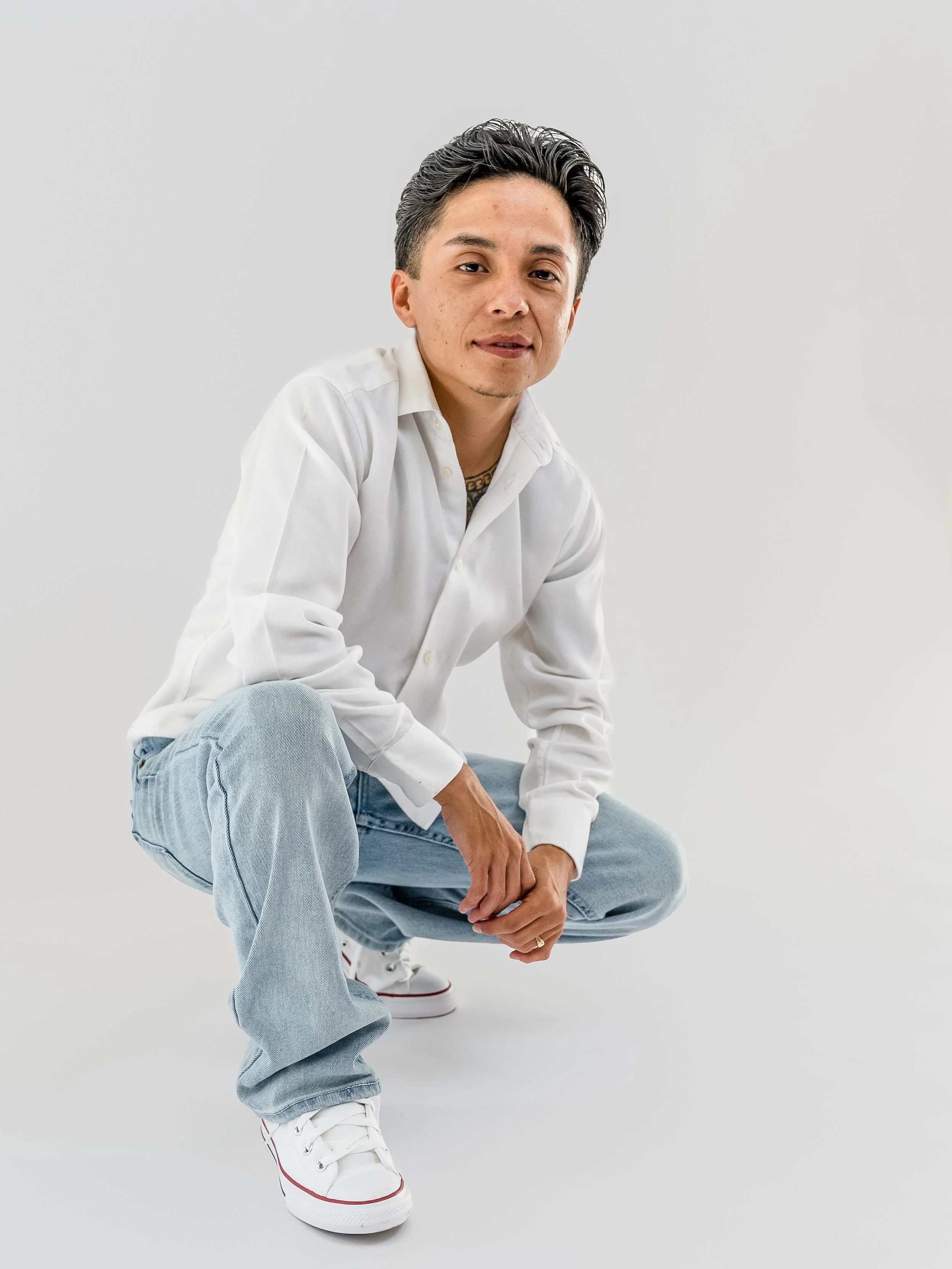 Clean, professional corporate headshot of a man in a white button-down shirt, photographed against a seamless white background on the Central Coast.