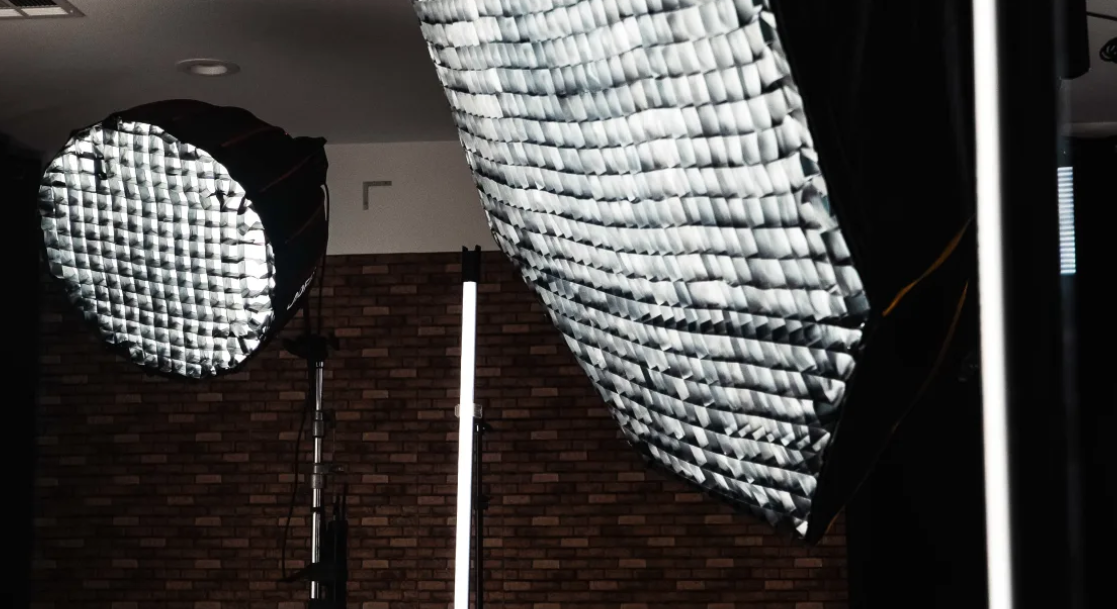 Overhead studio softbox lighting modifier and photography backdrop setup at Creative Juices production space