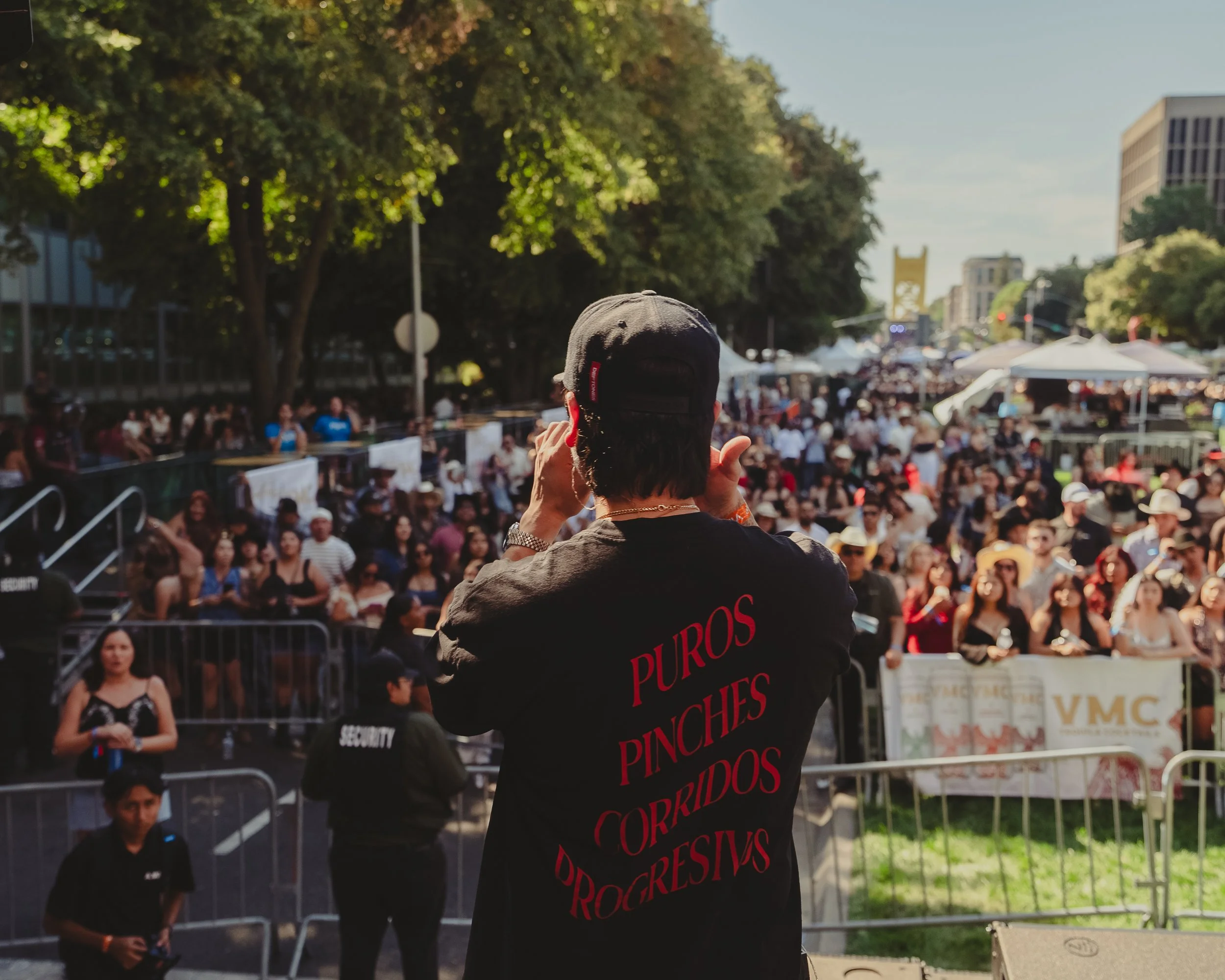 Creative director overlooking a large outdoor live event, representing on-set creative direction, event coverage, and brand strategy services on the Central Coast.